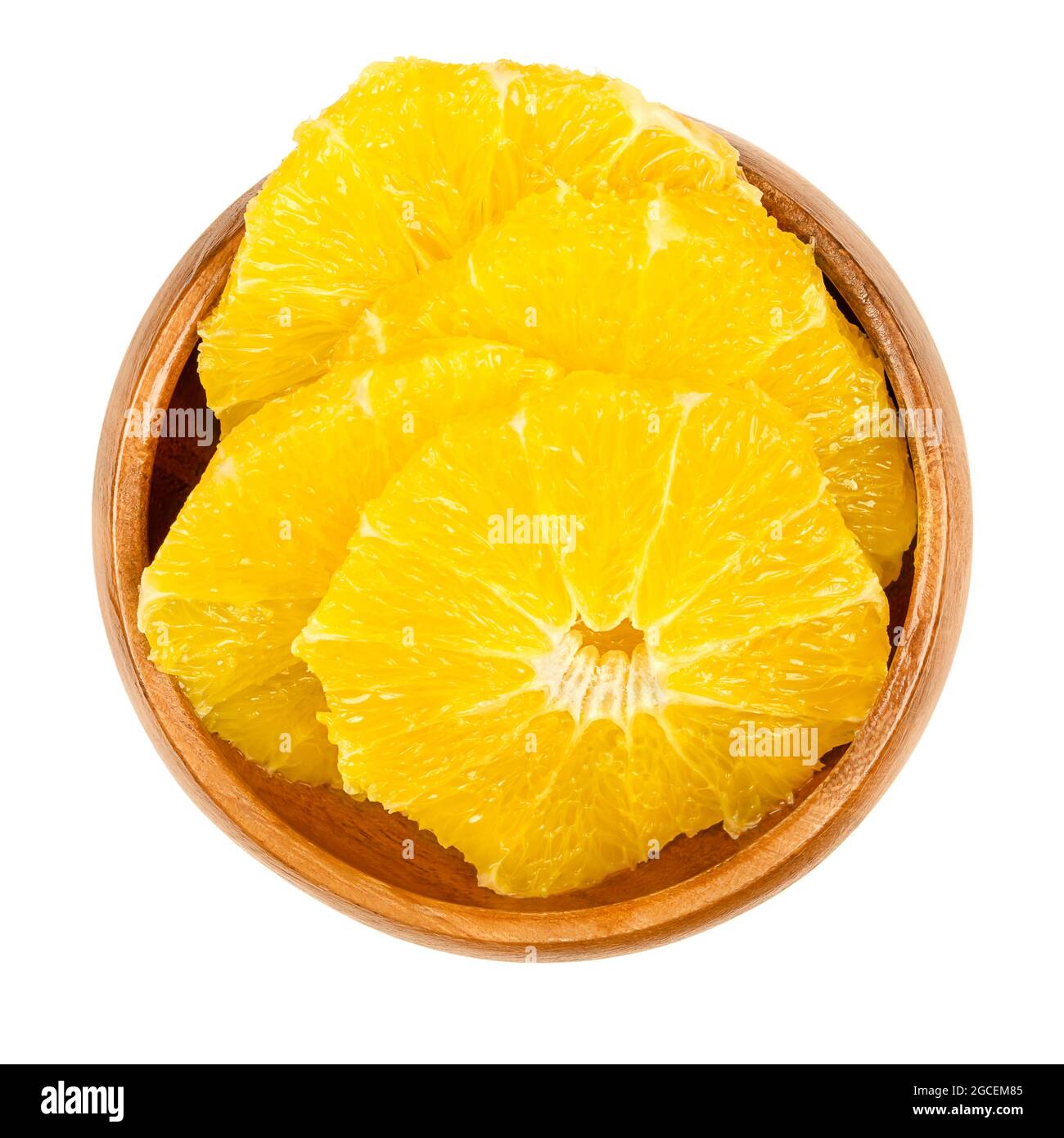 Peeled orange, cross section slices, in a wooden bowl. Sliced, fresh and ripe orange, cut sweet fruit with juicy and yellow fruit flesh. Stock Photo