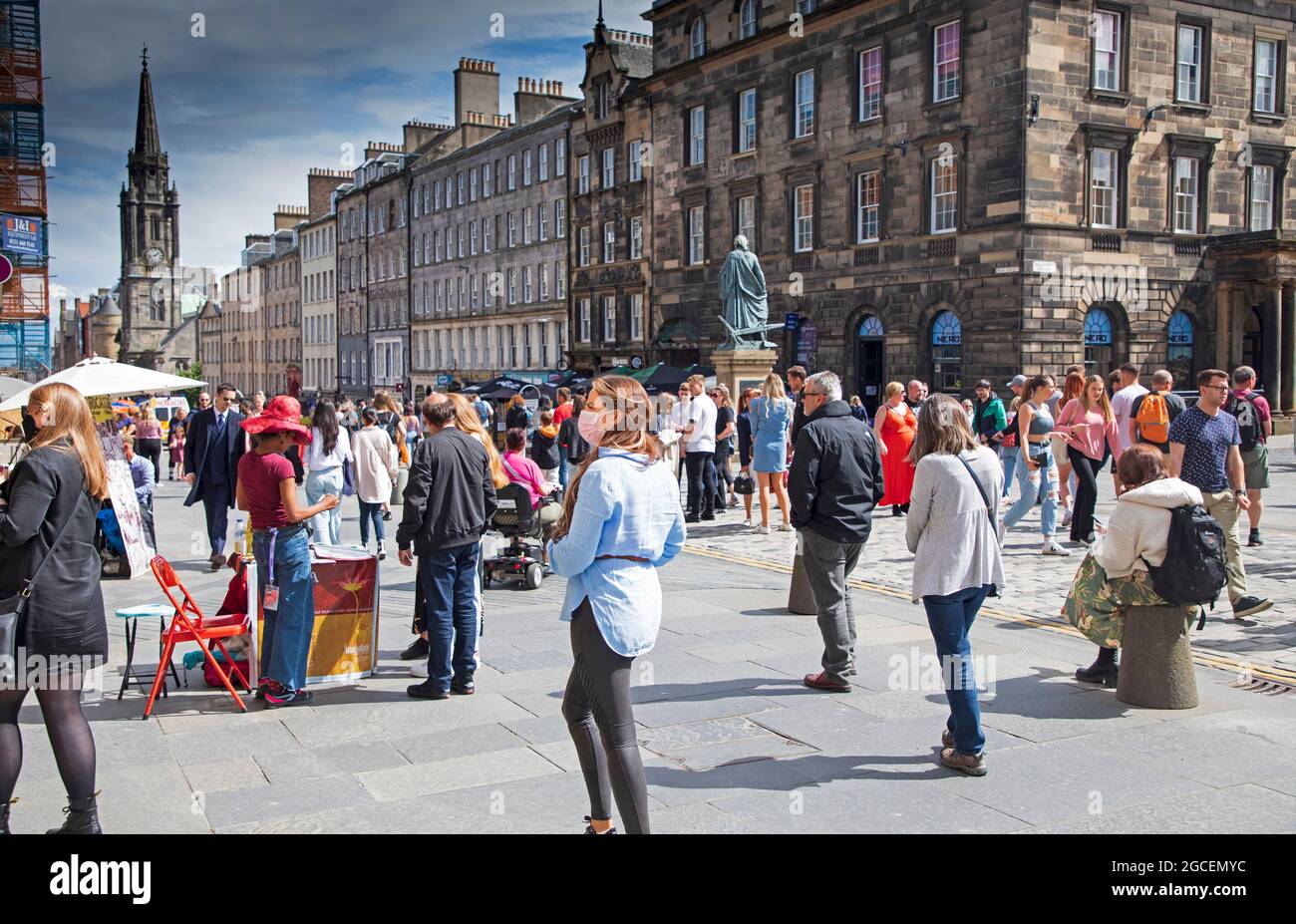 Royal Mile, Edinburgh Fringe, Scotland, UK. 8th July 2021. Sunny for the first Sunday of the Fringe on the High Street. Quieter than past years due to the scaled back events relating to the Covid Panademic. Credit: Arch White/Alamy Live News. Stock Photo
