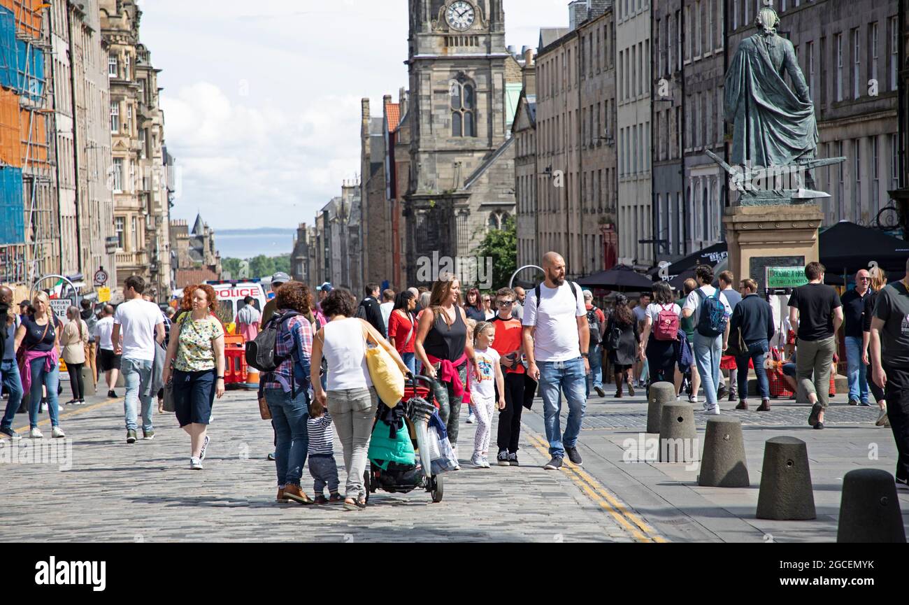 Royal Mile, Edinburgh Fringe, Scotland, UK. 8th July 2021. Sunny for the first Sunday of the Fringe on the High Street. Quieter than past years due to the scaled back events relating to the Covid Panademic. Credit: Arch White/Alamy Live News. Stock Photo