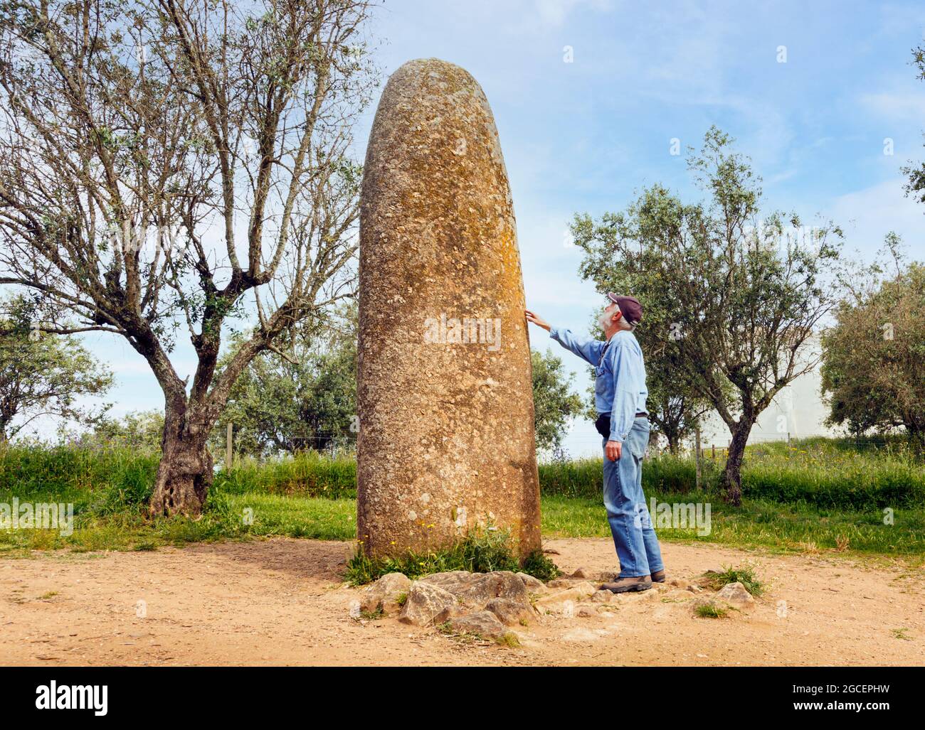 near Evora, Evora District, Alentejo, Portugal.  The isolated Menir dos Almendres neolithic standing stone, which is approximately 4.5 meters, or 14.7 Stock Photo