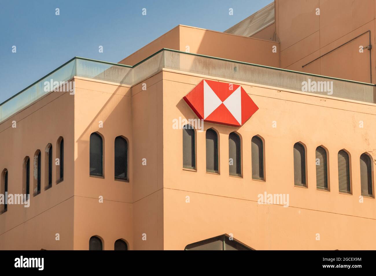 23 February 2021, Dubai, UAE: HSBC holding financial and banking institution logo on facade of old arabian building in Bur Dubai District Stock Photo