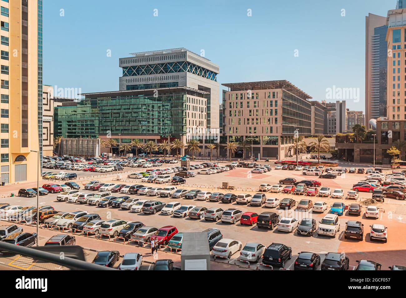 24 February 2021, Dubai, UAE: Large filled open-air parking lot with hundreads of cars near the hotel and business center in Dubai Stock Photo