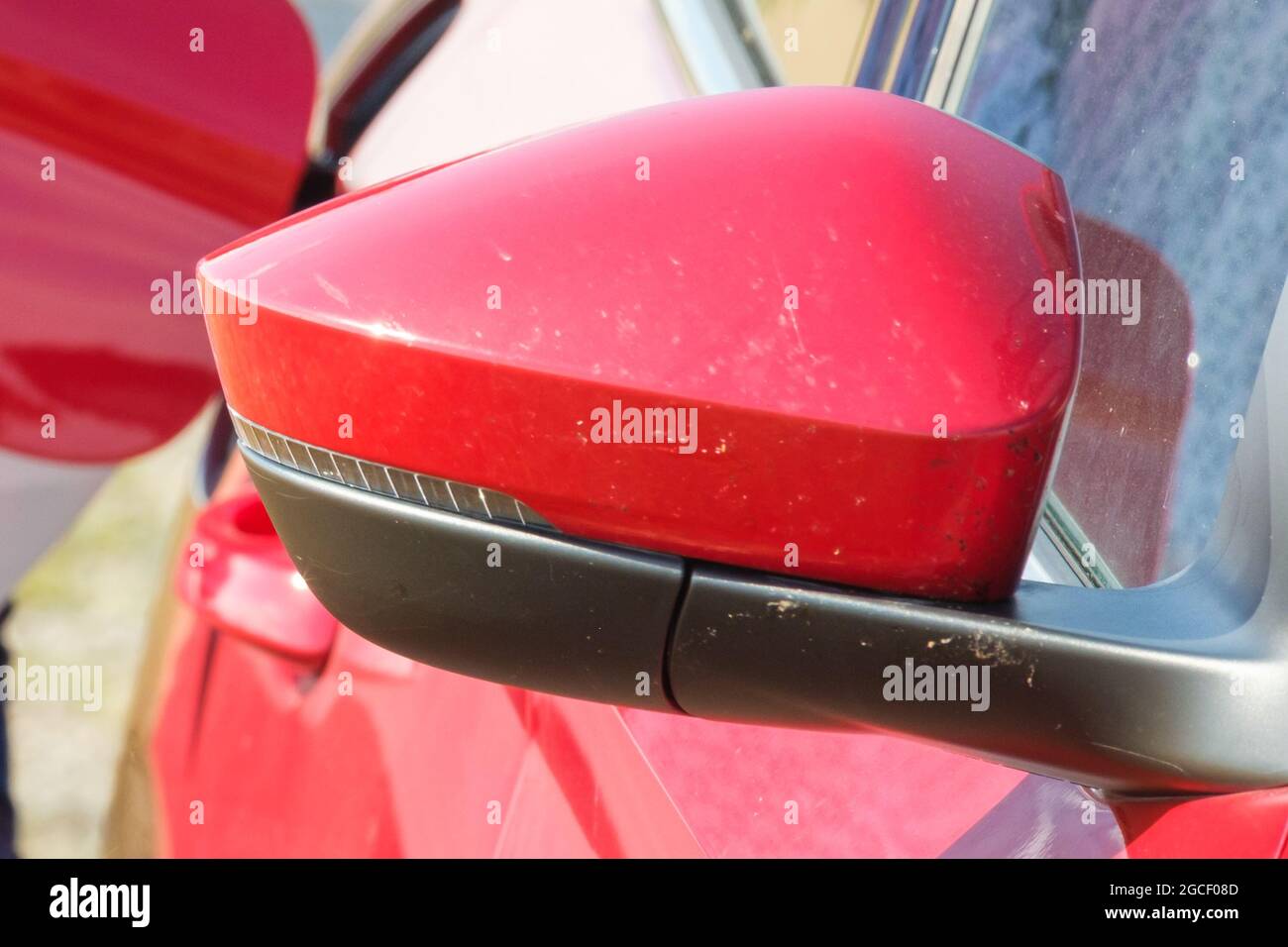 Side rearview mirror of red car Stock Photo