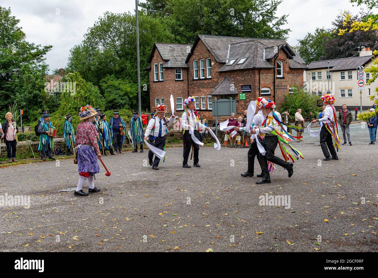 Lymm Morris Dancers Perform In Front Of Bollin Morris Dancers Hi res 