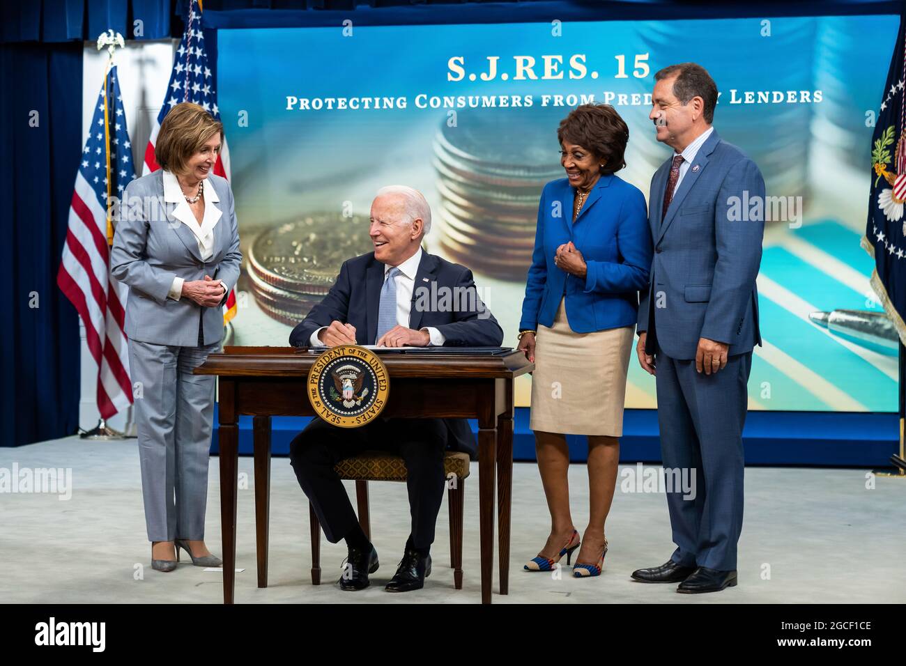 President Joe Biden, joined by House Speaker Nancy Pelosi, D-Calif., Rep. Maxine Waters, D-Calif., and Rep. Jesus “Chuy” Garcia, D-Ill., signs the Methane, Equal Employment Opportunity Commission and True Lender CRA Bills, Wednesday, June 30, 2021, in the South Court Auditorium in the Eisenhower Executive Office Building at the White House. (Official White House Photo by Adam Schultz) Stock Photo