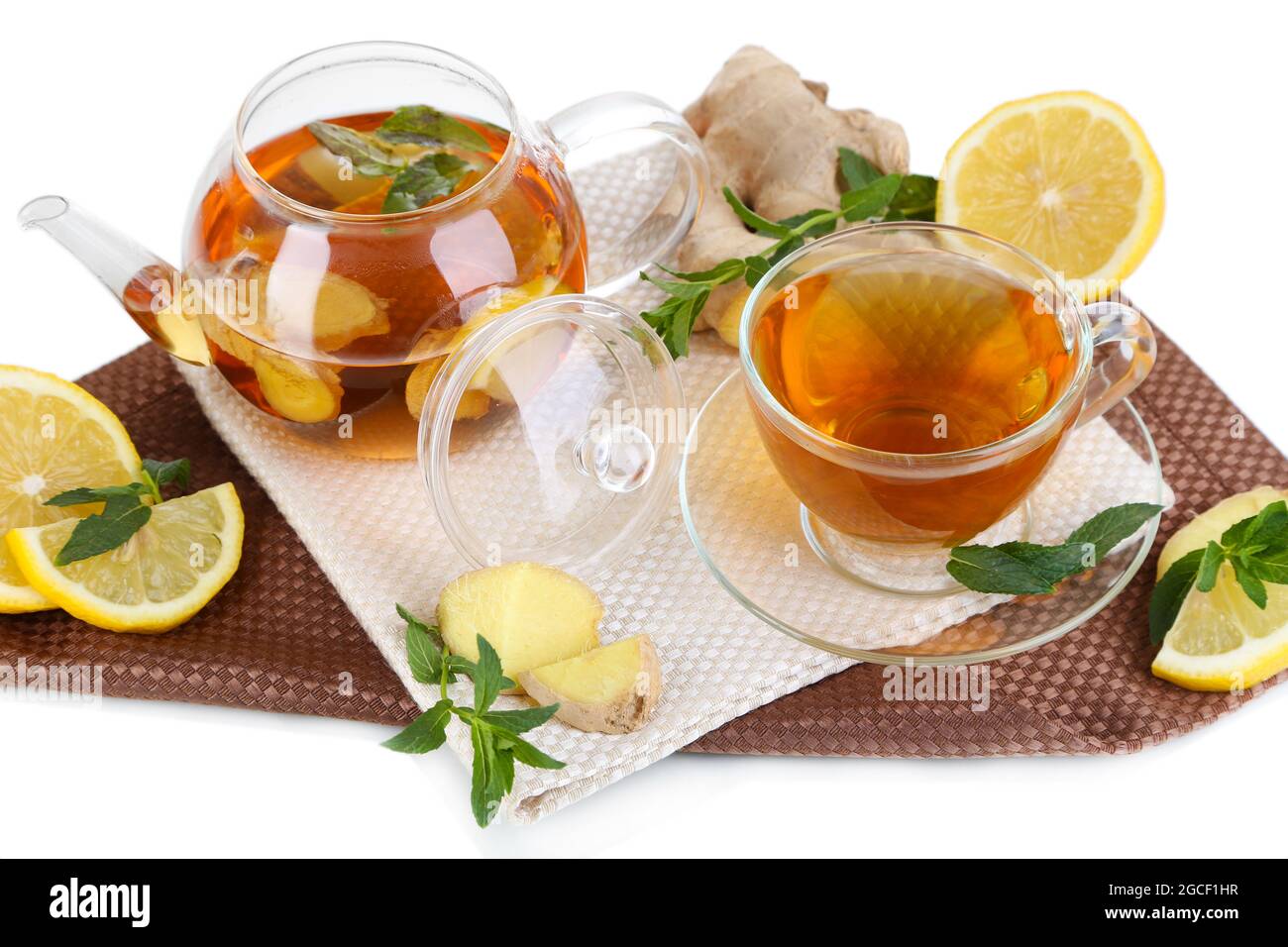 Kettle and cup of tea with ginger on napkin isolated on white Stock ...