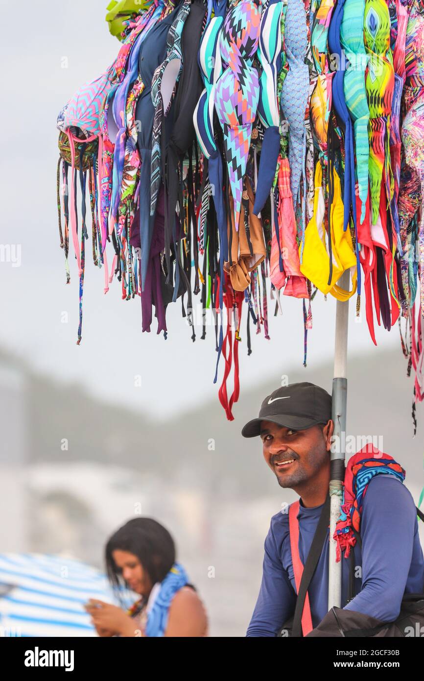 R, BRAZIL - Dec 06, 2017: A vertical shot of male selling swimsuits on ...