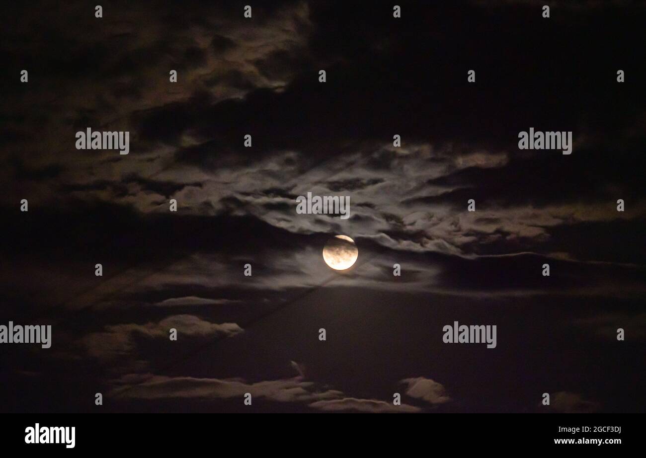full moon in the sky with clouds landscape Stock Photo - Alamy