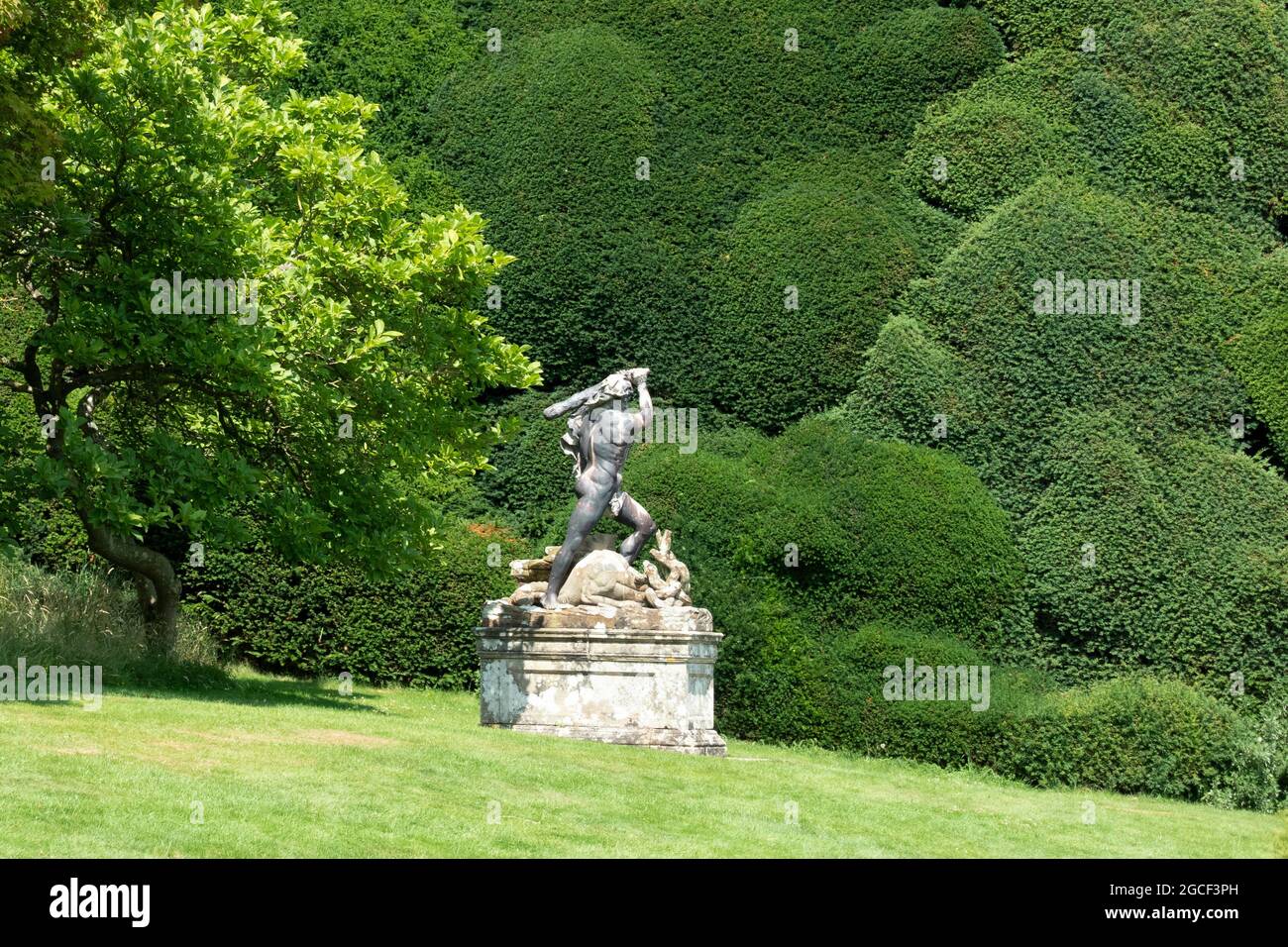 A statue in the grounds of Powis Castle depicting Hercules battling the Hydra. Powis Castle, Wales. Stock Photo