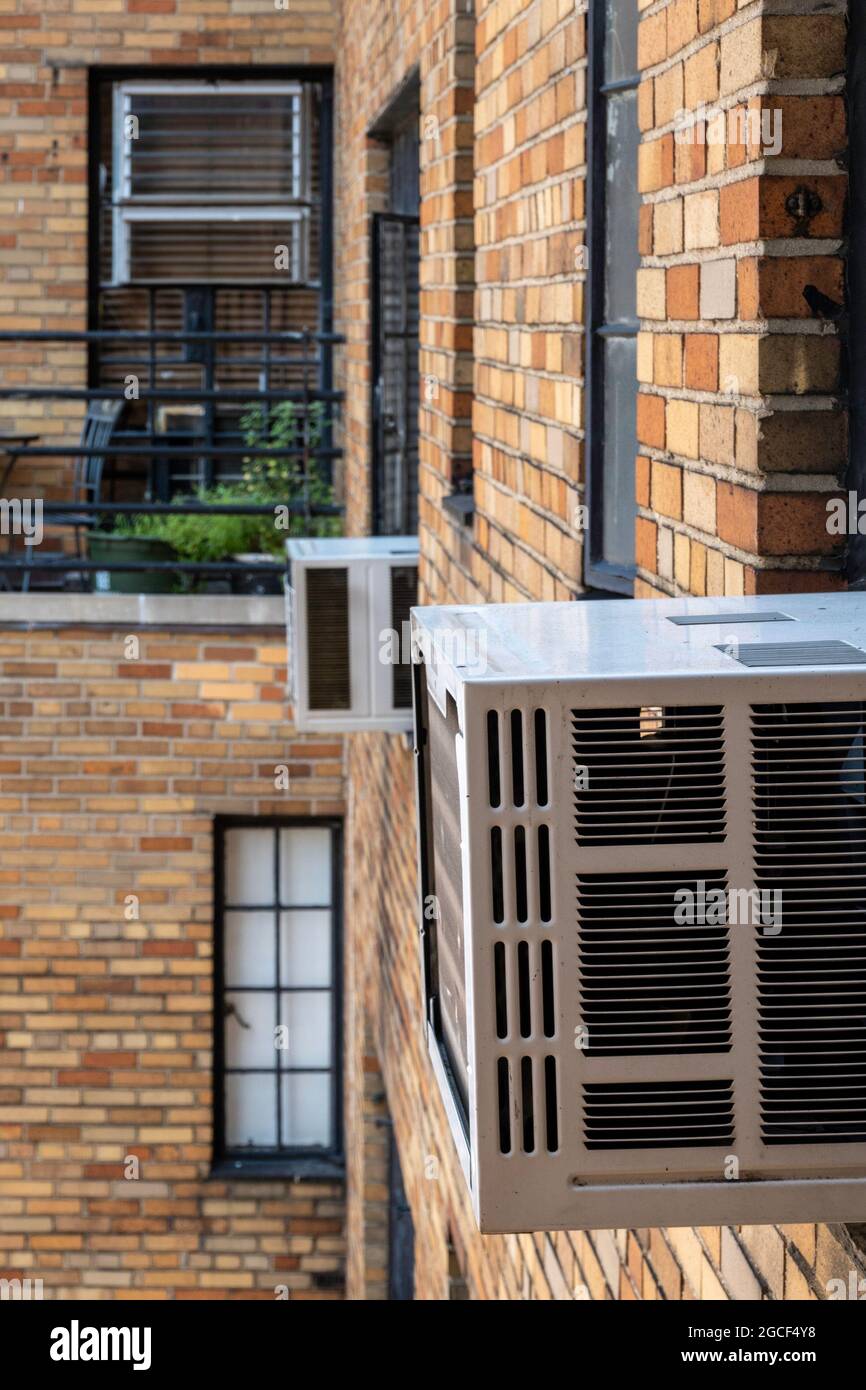 Window mounted air conditioners are used in New York City buildings
