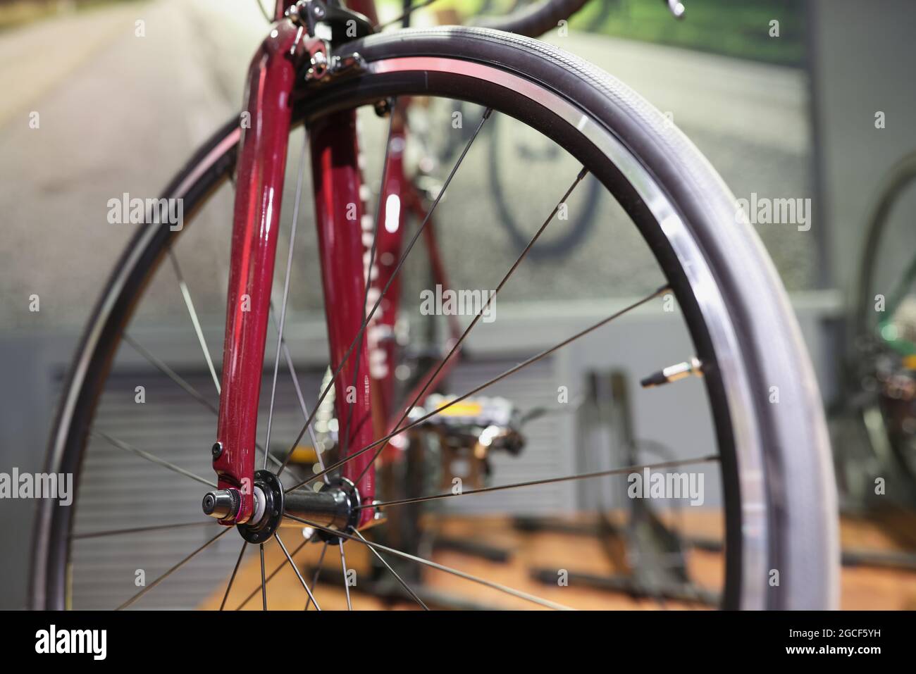 Red disassembled bicycle stands in workshop closeup Stock Photo