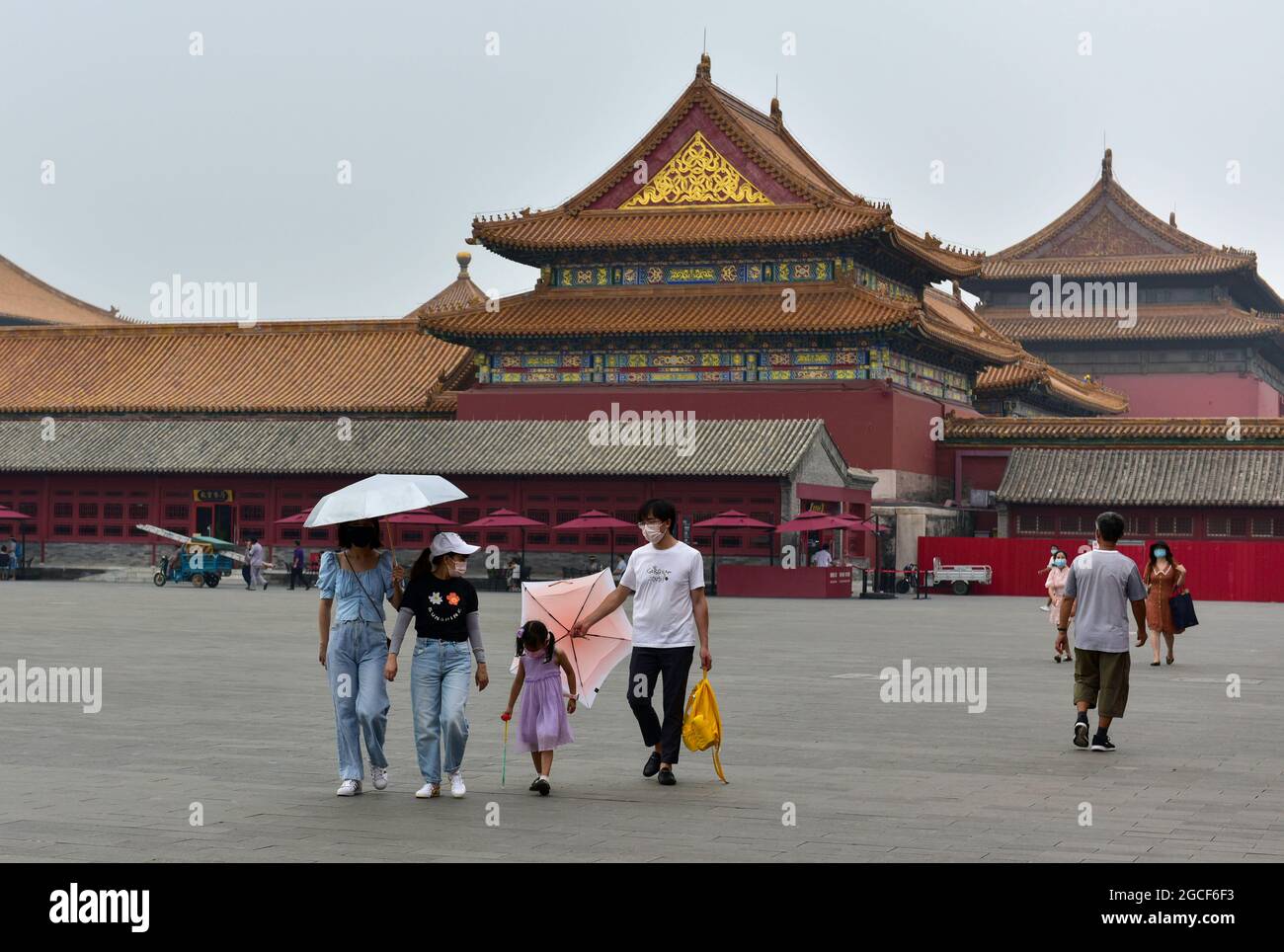 Beijing, China. 08th Aug, 2024. People wearing face masks as a preventive measure against the spread of covid-19 walk around the Forbidden City in Beijing. President Xi Jinping said on Thursday that China will provide a total of 2 billion doses of COVID-19 vaccines to the world this year, in the latest effort to honor its commitment to make vaccines a global public good by ensuring vaccine accessibility and affordability. Credit: SOPA Images Limited/Alamy Live News Stock Photo