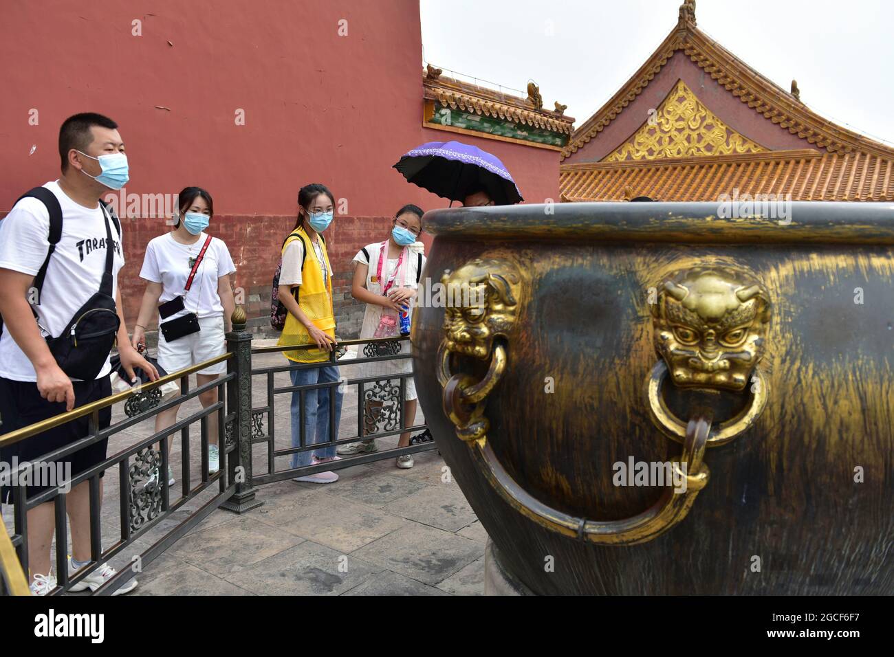 Beijing, China. 08th Aug, 2024. People wearing face masks as a preventive measure against the spread of covid-19 are seen at the Forbidden City in Beijing. President Xi Jinping said on Thursday that China will provide a total of 2 billion doses of COVID-19 vaccines to the world this year, in the latest effort to honor its commitment to make vaccines a global public good by ensuring vaccine accessibility and affordability. Credit: SOPA Images Limited/Alamy Live News Stock Photo