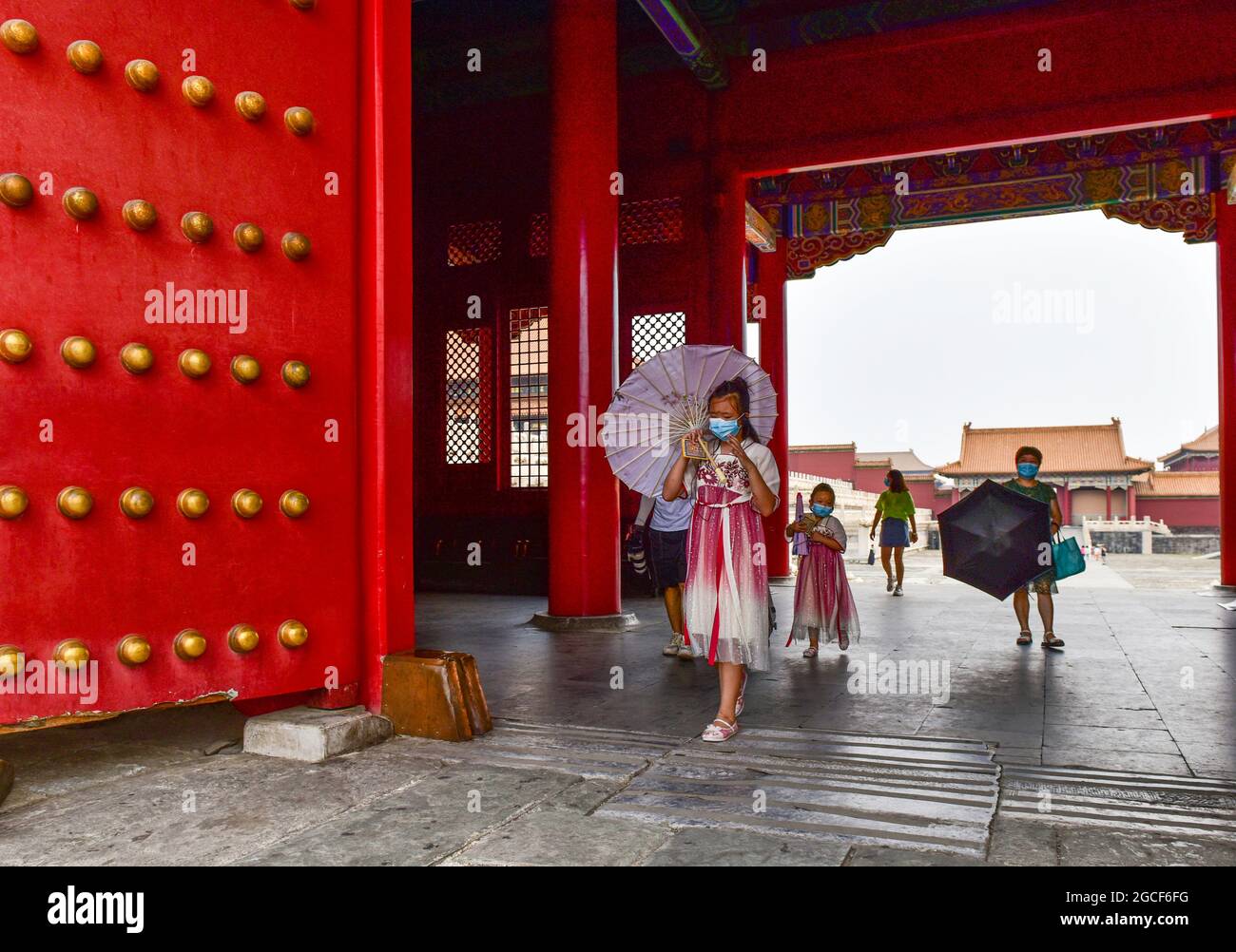 Beijing, China. 08th Aug, 2024. People wearing face masks as a preventive measure against the spread of covid-19 walk around the Forbidden City in Beijing. President Xi Jinping said on Thursday that China will provide a total of 2 billion doses of COVID-19 vaccines to the world this year, in the latest effort to honor its commitment to make vaccines a global public good by ensuring vaccine accessibility and affordability. Credit: SOPA Images Limited/Alamy Live News Stock Photo