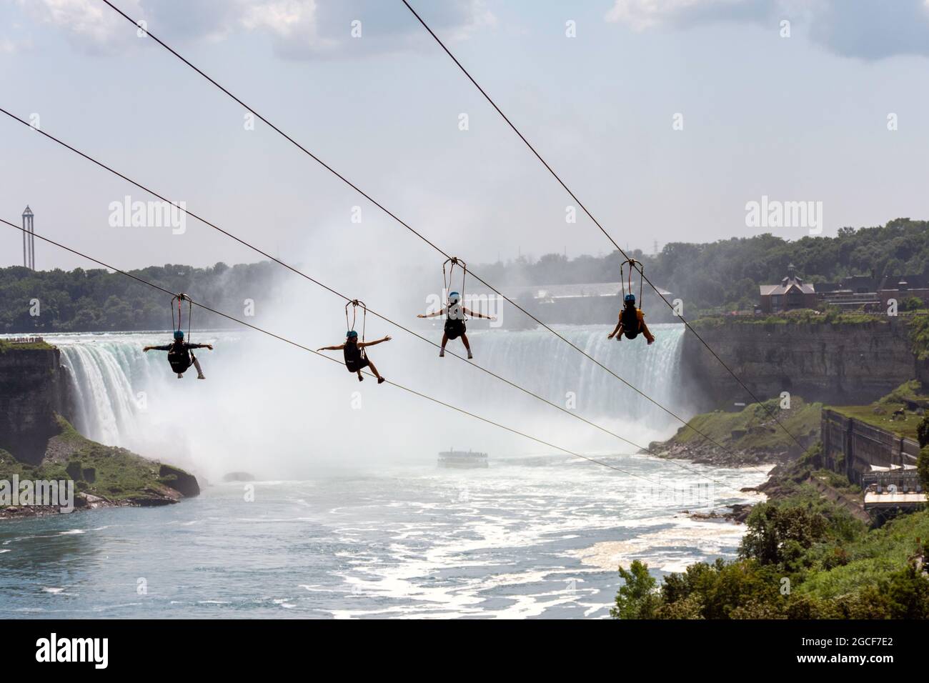 Niagara Falls Zipline riders are required to wear masks during the global pandemic. Stock Photo