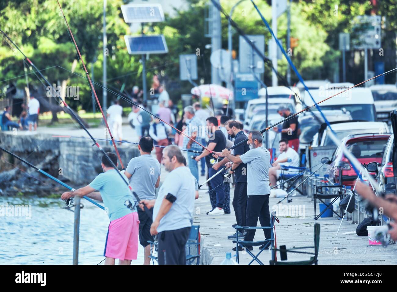 People Rading Fish People fishing by the sea, fishermen trying to fish with their fishing ...