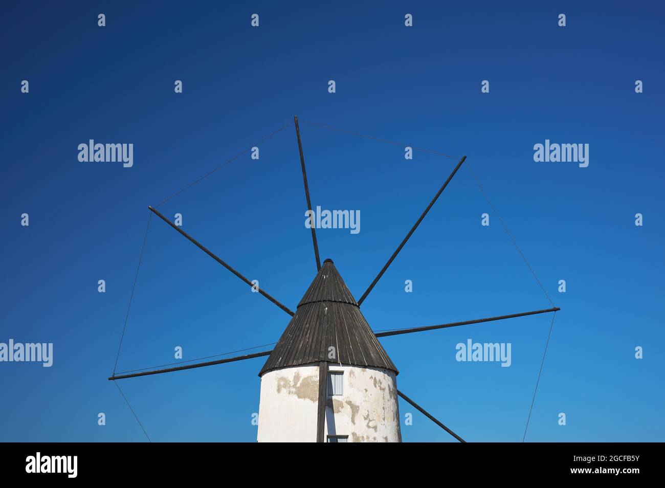detail of an old windmill with blades over blue sky Stock Photo