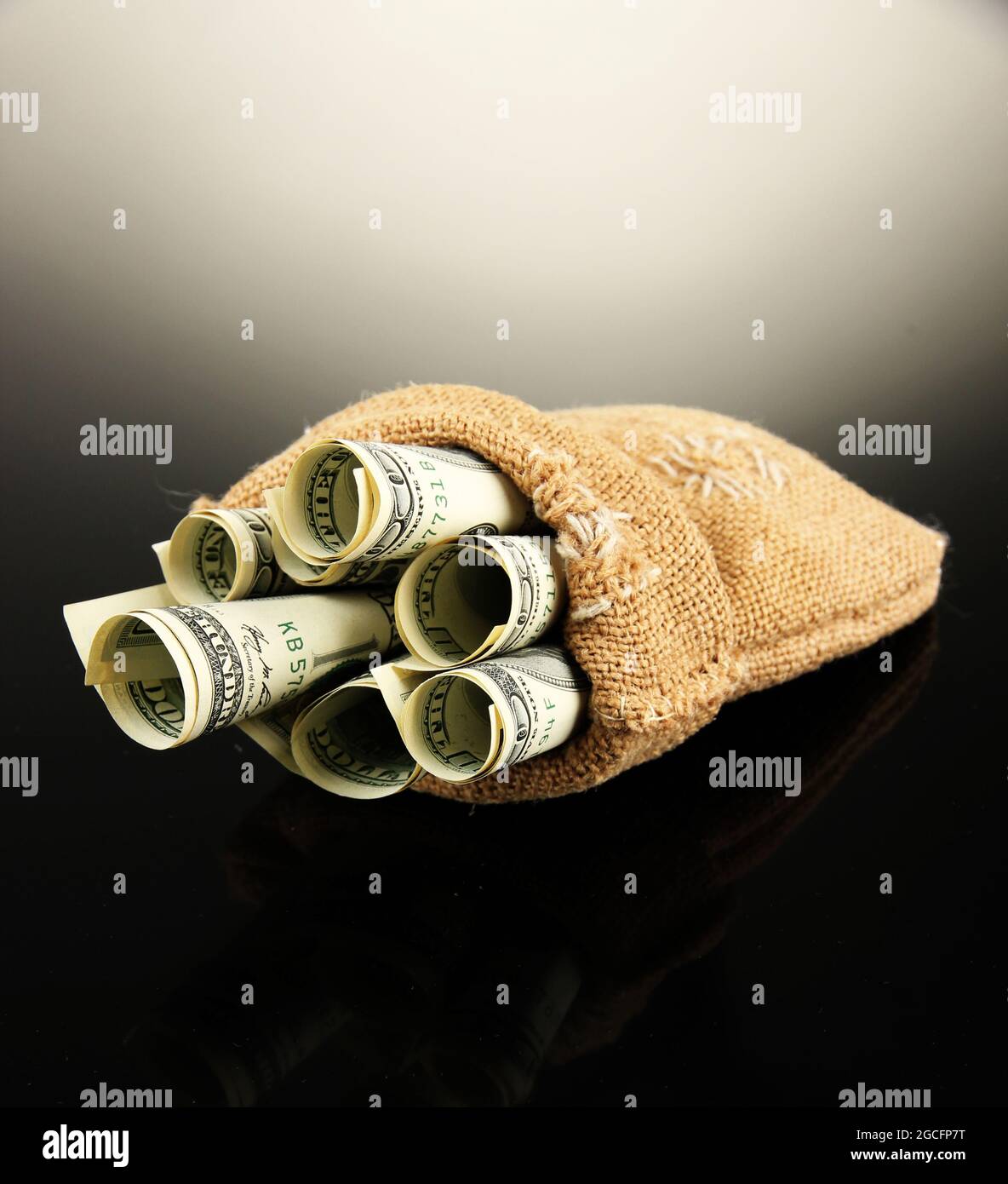 Money in bag on dark background Stock Photo Alamy