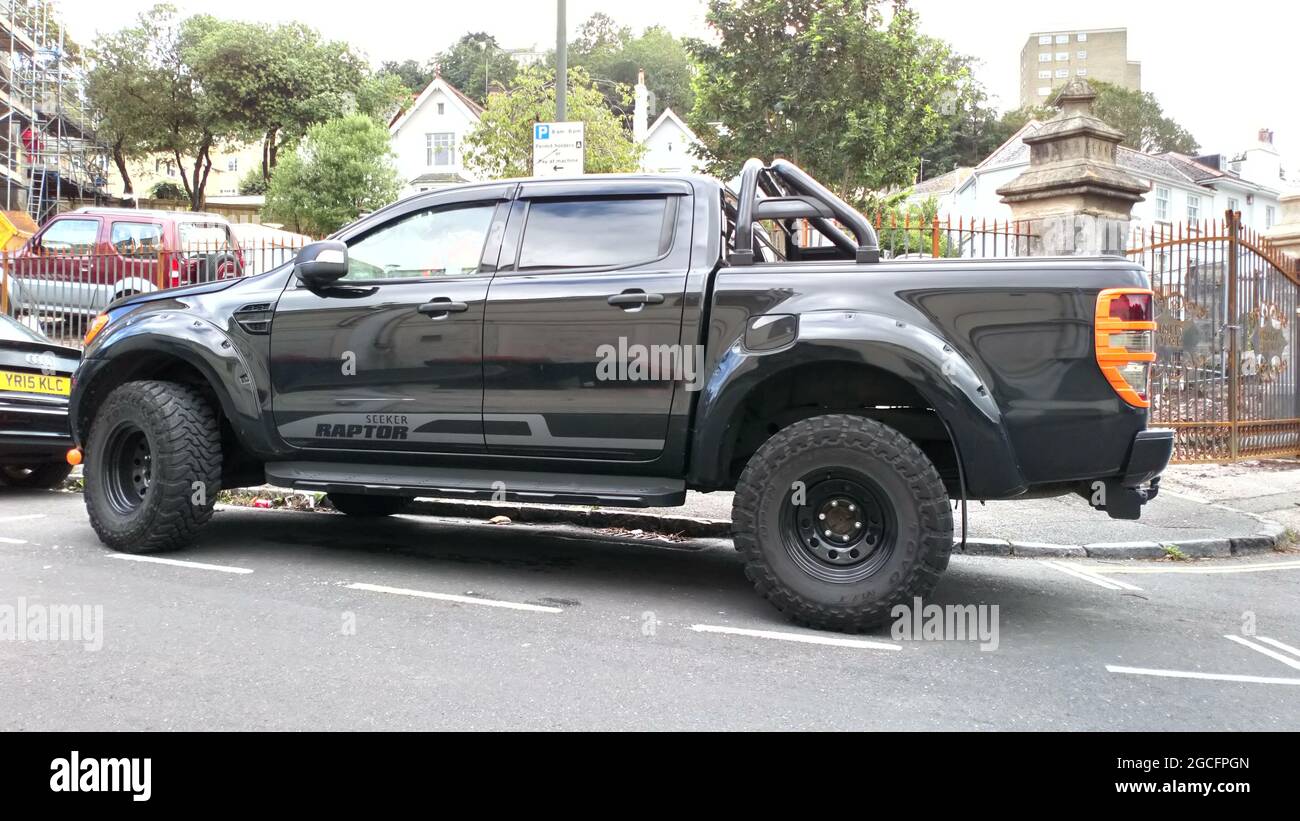 A 2016 Ford F-150 Raptor pickup truck parked up in Torquay, Devon, England, UK. Stock Photo