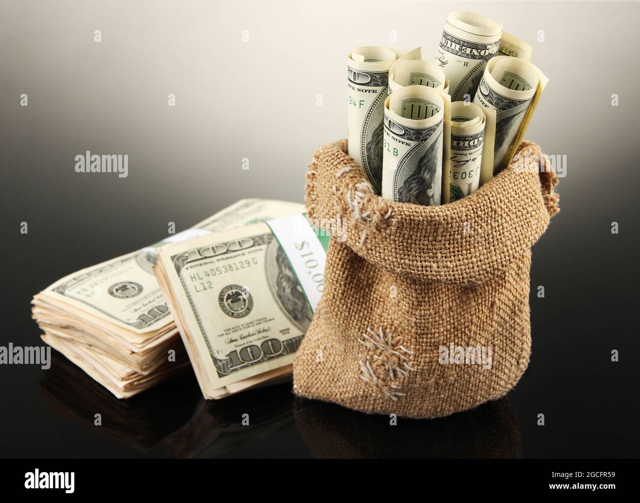 Money in bag on dark background Stock Photo Alamy