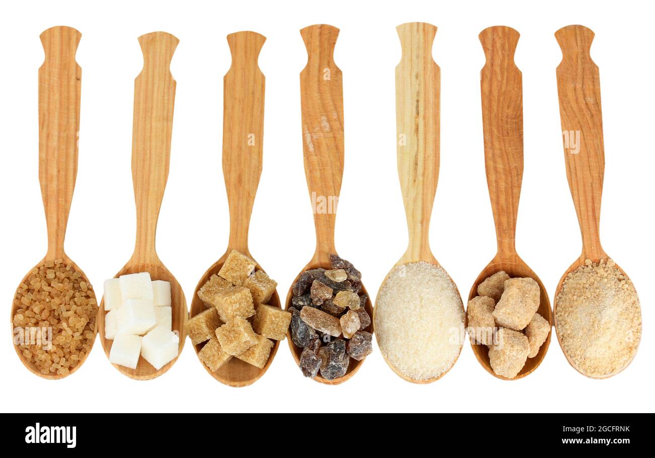 Different types of sugar in spoons isolated on white Stock Photo Alamy
