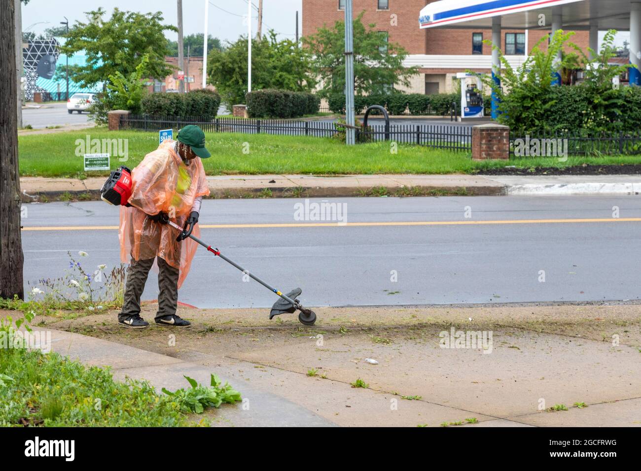 Detroit, Michigan - Volunteers with the MorningSide Community Organiztion remove weeds from a small park on the edge of their neighborhood. The were w Stock Photo