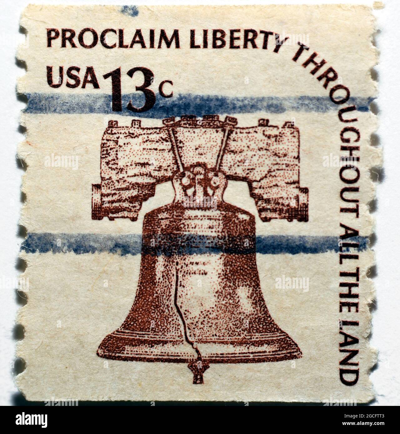 Old used American postage stamp printed in the USA from the Americana issue shows the liberty bell with inscription (Proclaim Liberty Throughout All T Stock Photo