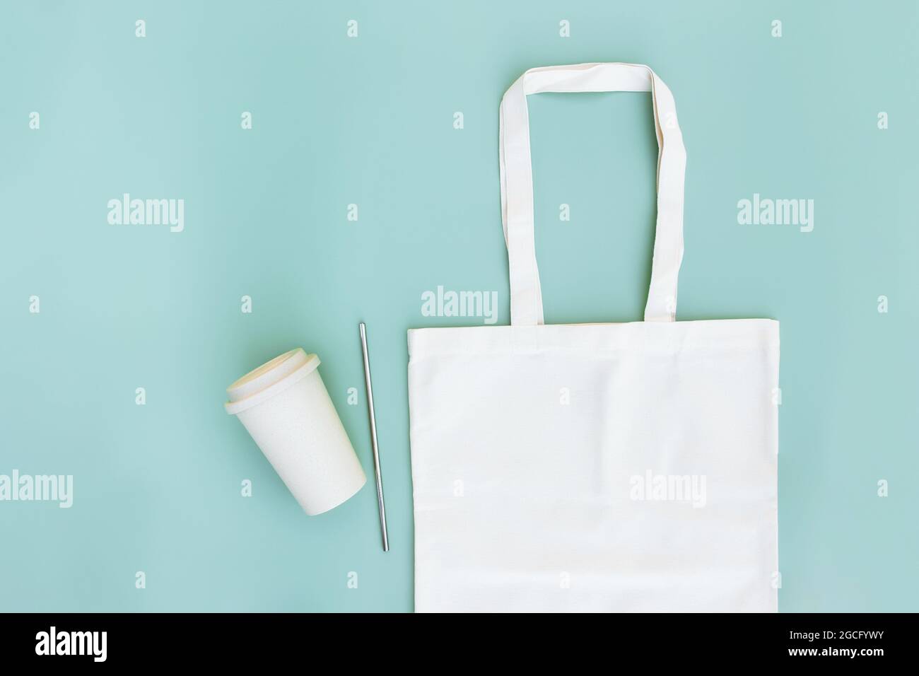 https://c8.alamy.com/comp/2GCFYWY/eco-white-craft-paper-bag-metal-drink-straw-coffee-cup-on-green-background-flat-lay-with-copy-space-empty-advertising-area-mock-up-for-delivery-ser-2GCFYWY.jpg