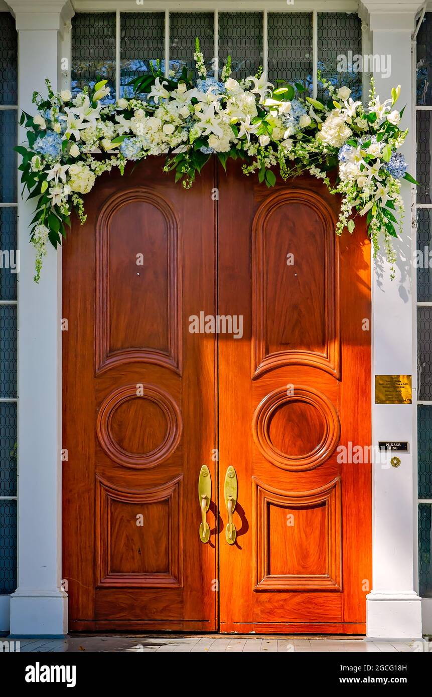 Easter lilies and other spring flowers adorn the front door of the Bragg-Mitchell Mansion, March 21, 2021, in Mobile, Alabama. Stock Photo