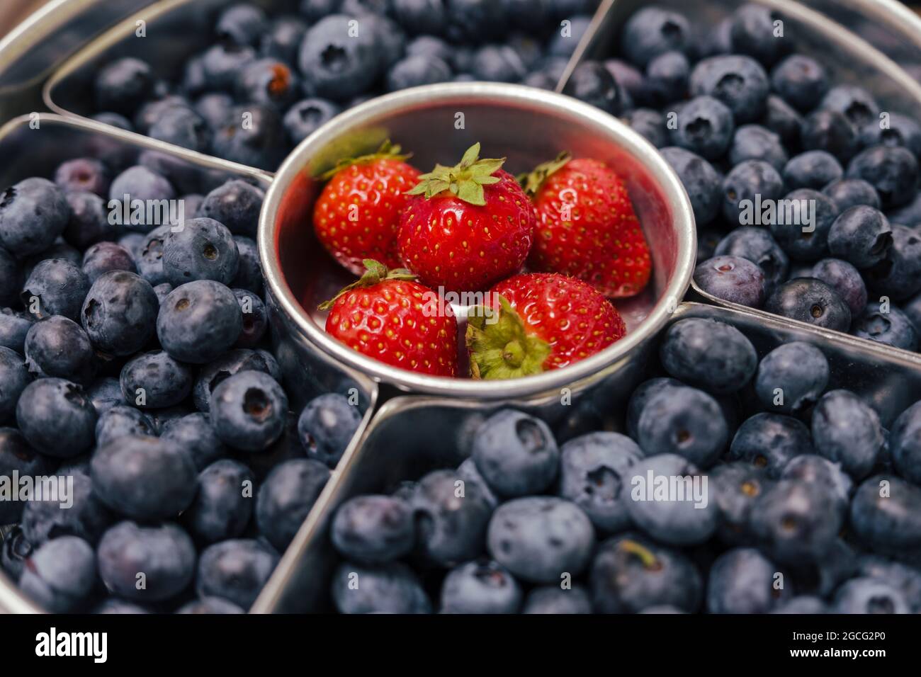 a platter of blueberries and strawberries Stock Photo
