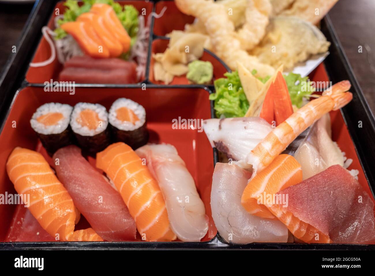 https://c8.alamy.com/comp/2GCG50A/selective-focus-and-top-view-at-sushi-bento-box-set-contain-salmon-and-tuna-nigiri-rolls-tempura-and-sashimi-2GCG50A.jpg