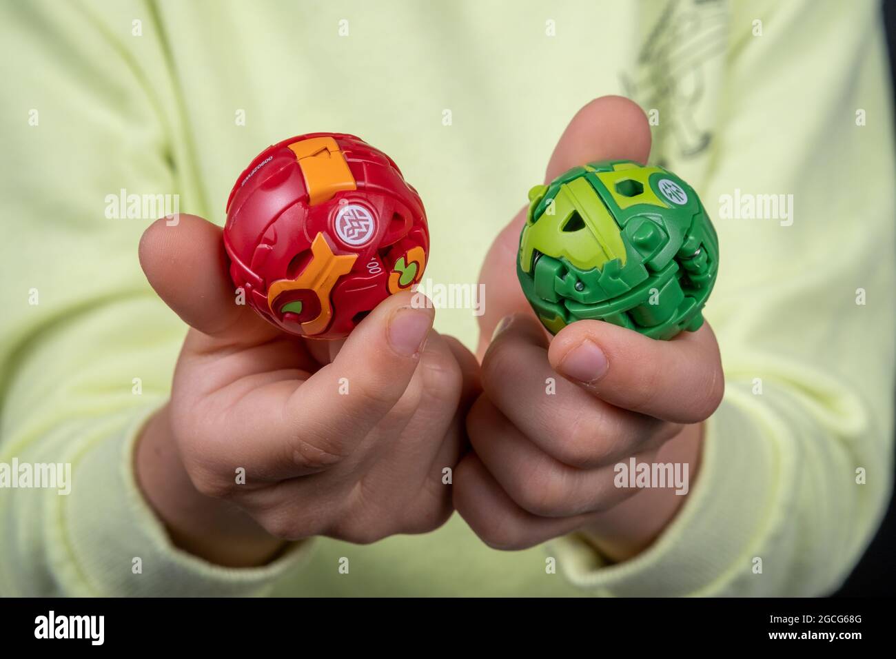 Bakugan Ball toys. New popular transformer toy assembled in ball shape, hold in child's hands. Stafford, United Kingdom, August 8, 2021 Stock Photo
