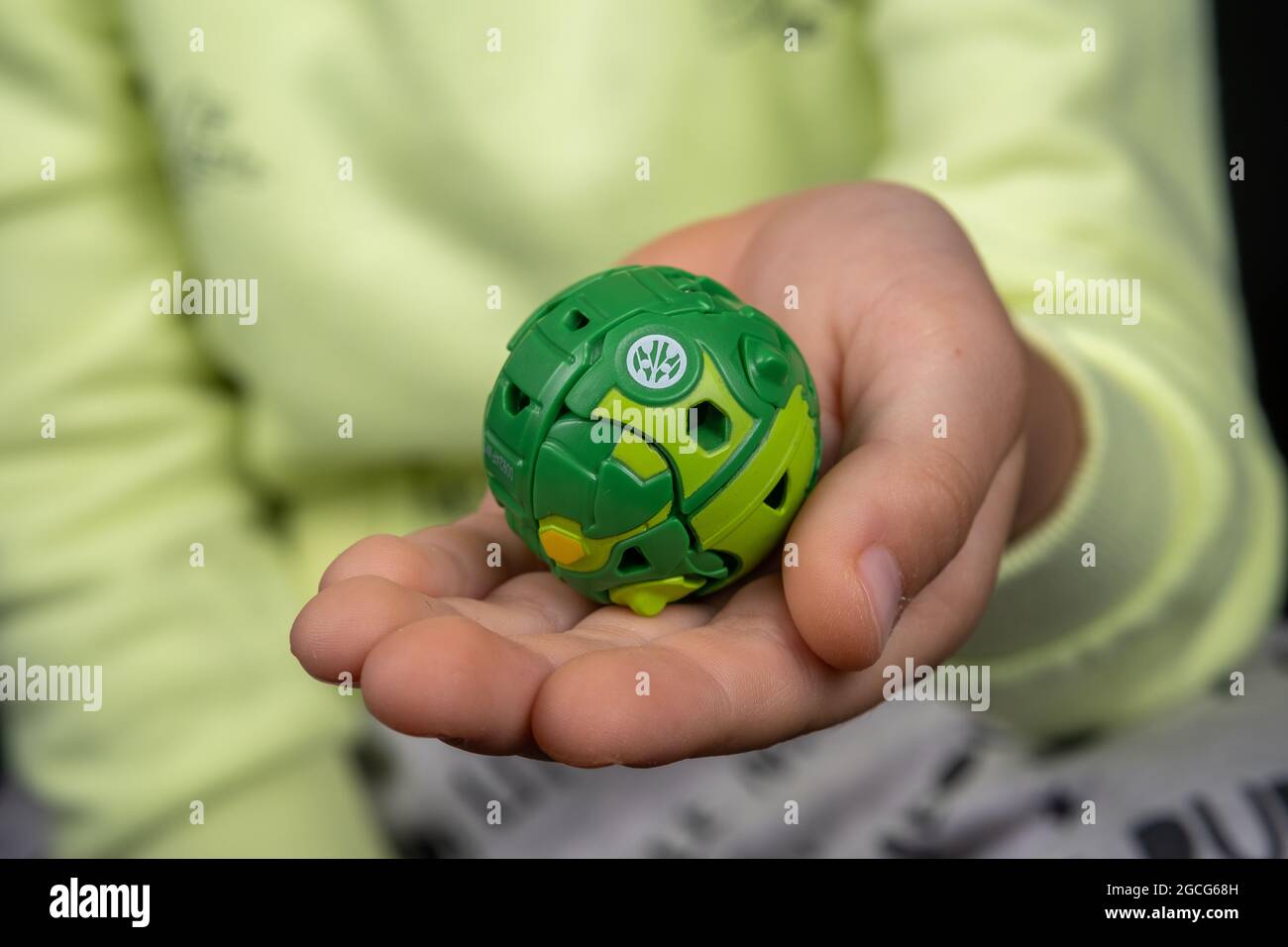 Bakugan Ball toy. New popular transformer toy assembled in ball shape, hold in child's hand. Stafford, United Kingdom, August 8, 2021 Stock Photo