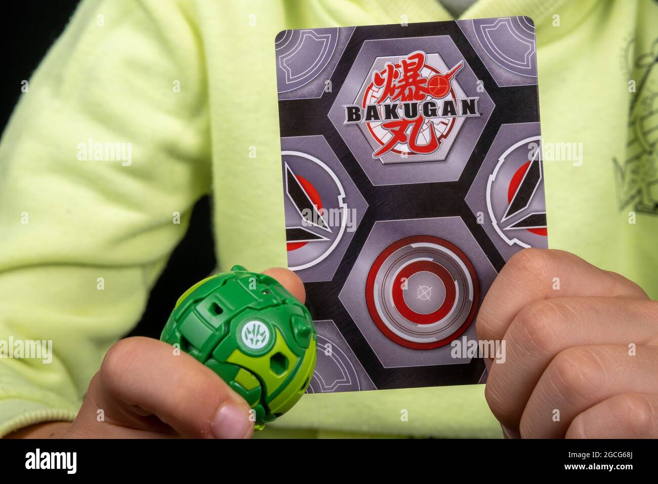 Bakugan Ball toy. New popular transformer toy assembled in ball shape, hold in child's hand with magnetic card. Stafford, United Kingdom, August 8, 20 Stock Photo