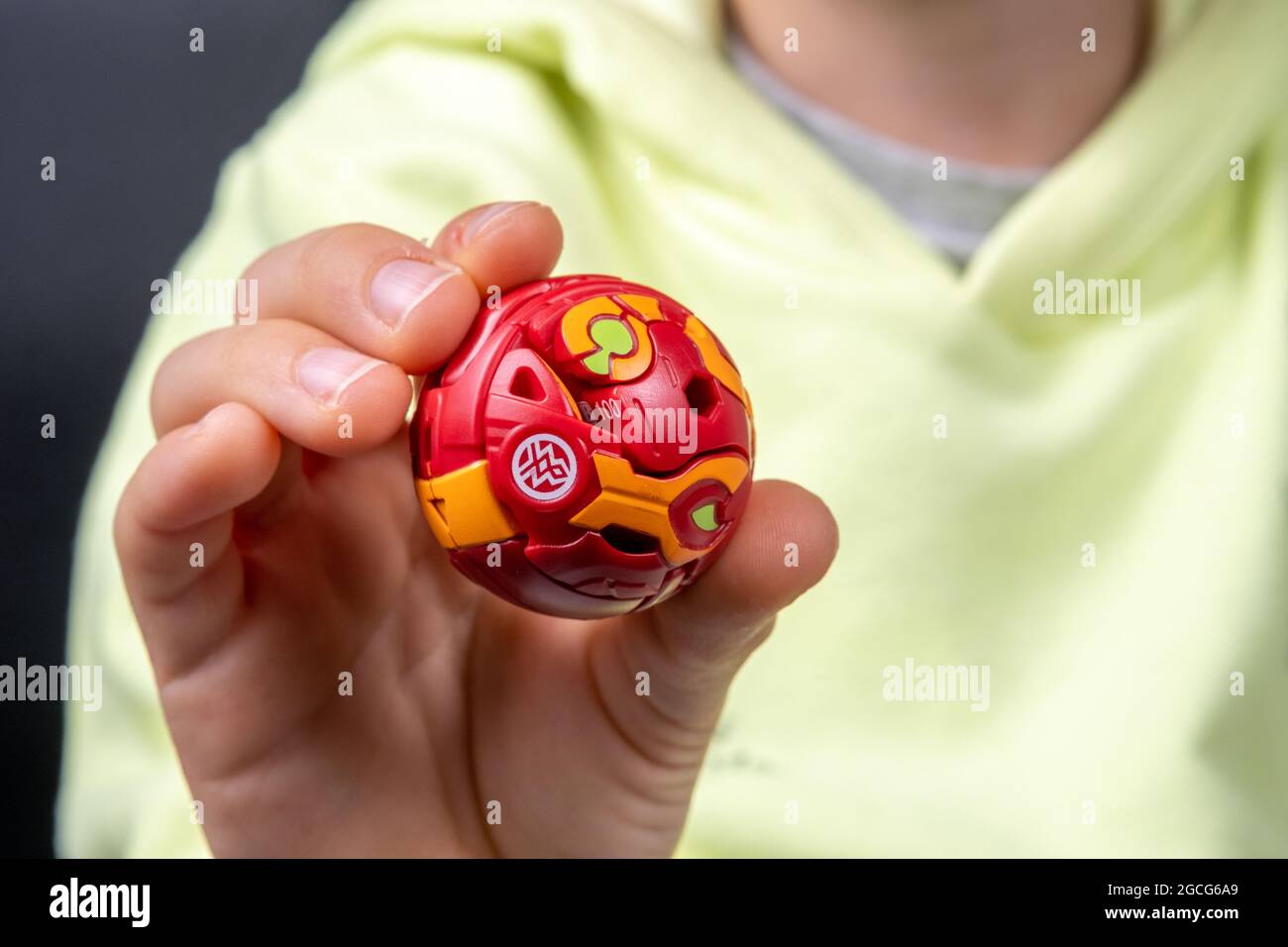 Bakugan Ball toy. New popular transformer toy assembled in ball shape, hold in child's hand. Stafford, United Kingdom, August 8, 2021 Stock Photo