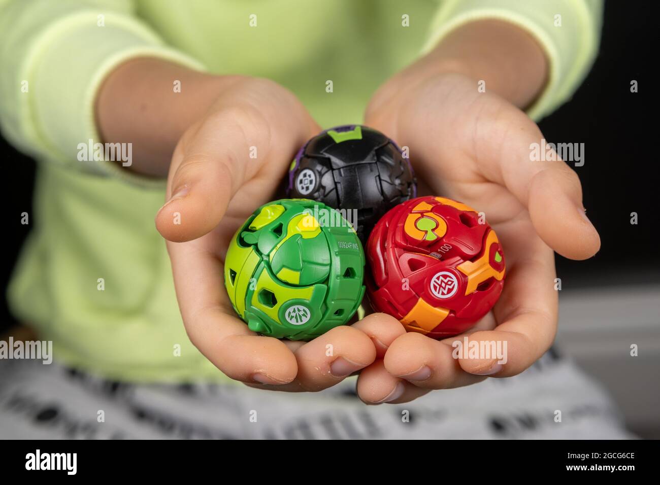 Bakugan Ball toys. New popular transformer toy assembled in ball shape, hold in child's hands. Stafford, United Kingdom, August 8, 2021 Stock Photo
