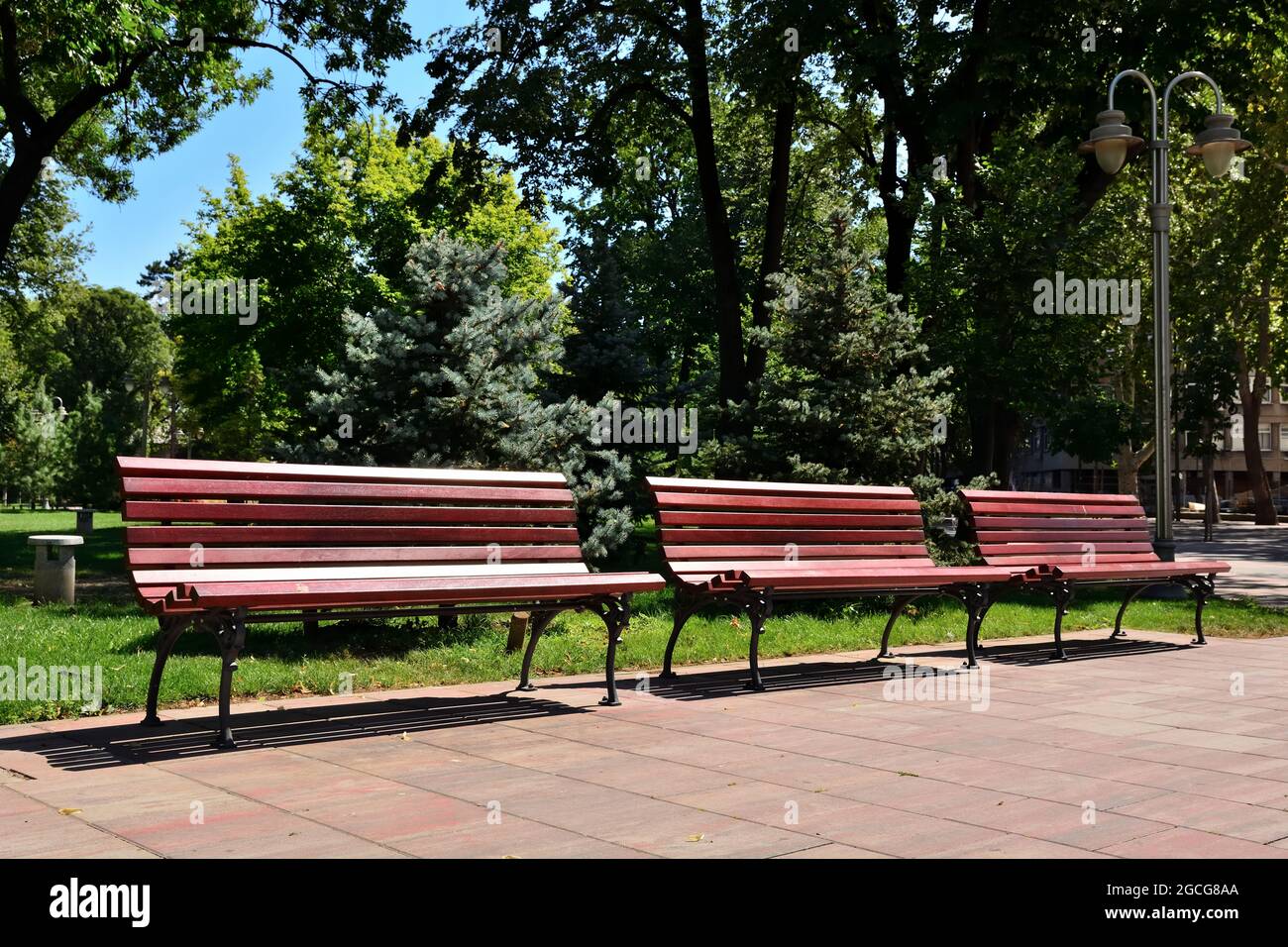 Three empty benches hi-res stock photography and images - Alamy