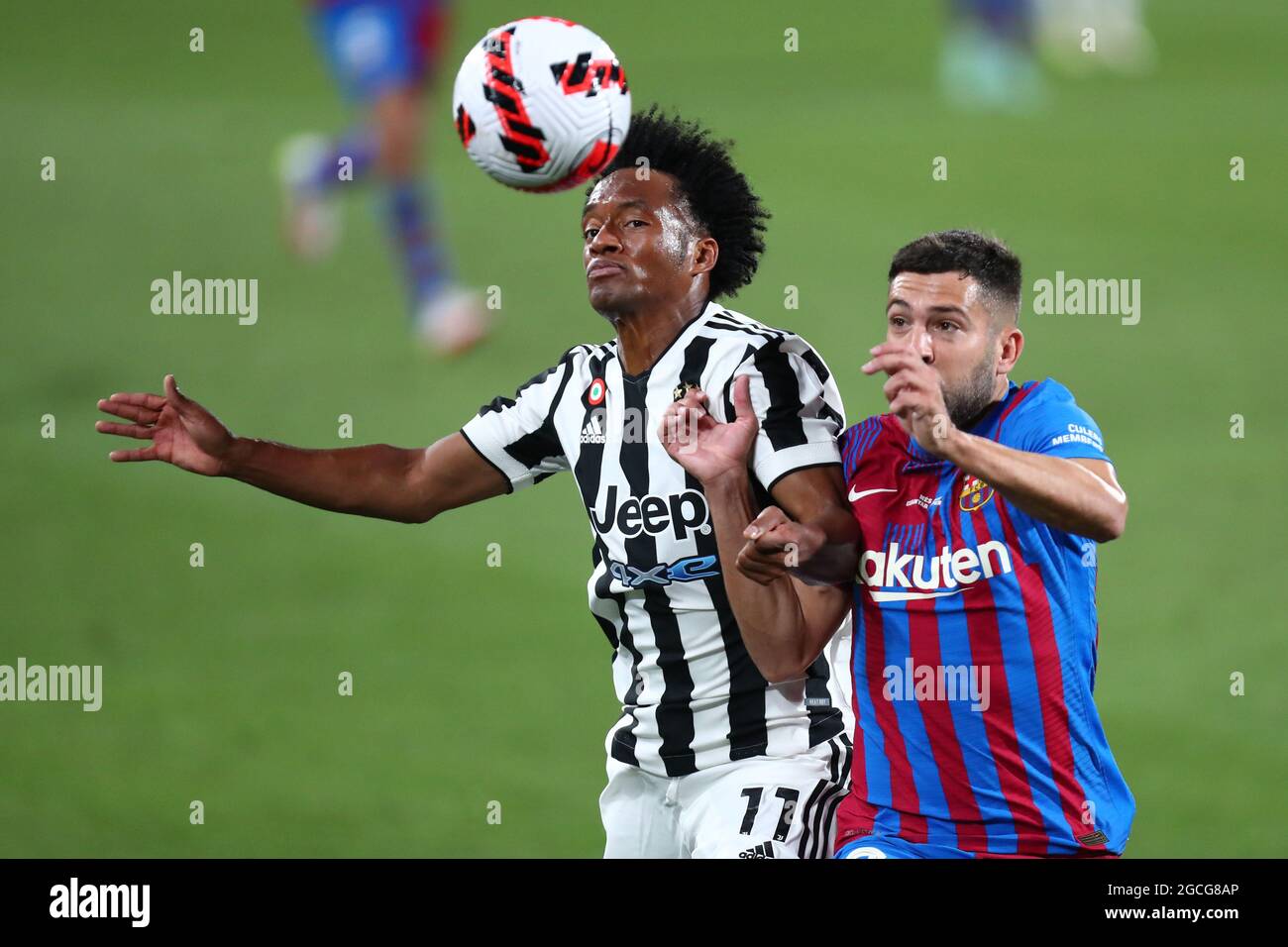 Barcelona Spain. 08th Aug 2021. Juan Cuadrado of Juventus Fc and Sergio Busquets of Fc Barcelona battle for the ball during the pre season friendly match between Fc Barcelona and Juventus Fc at