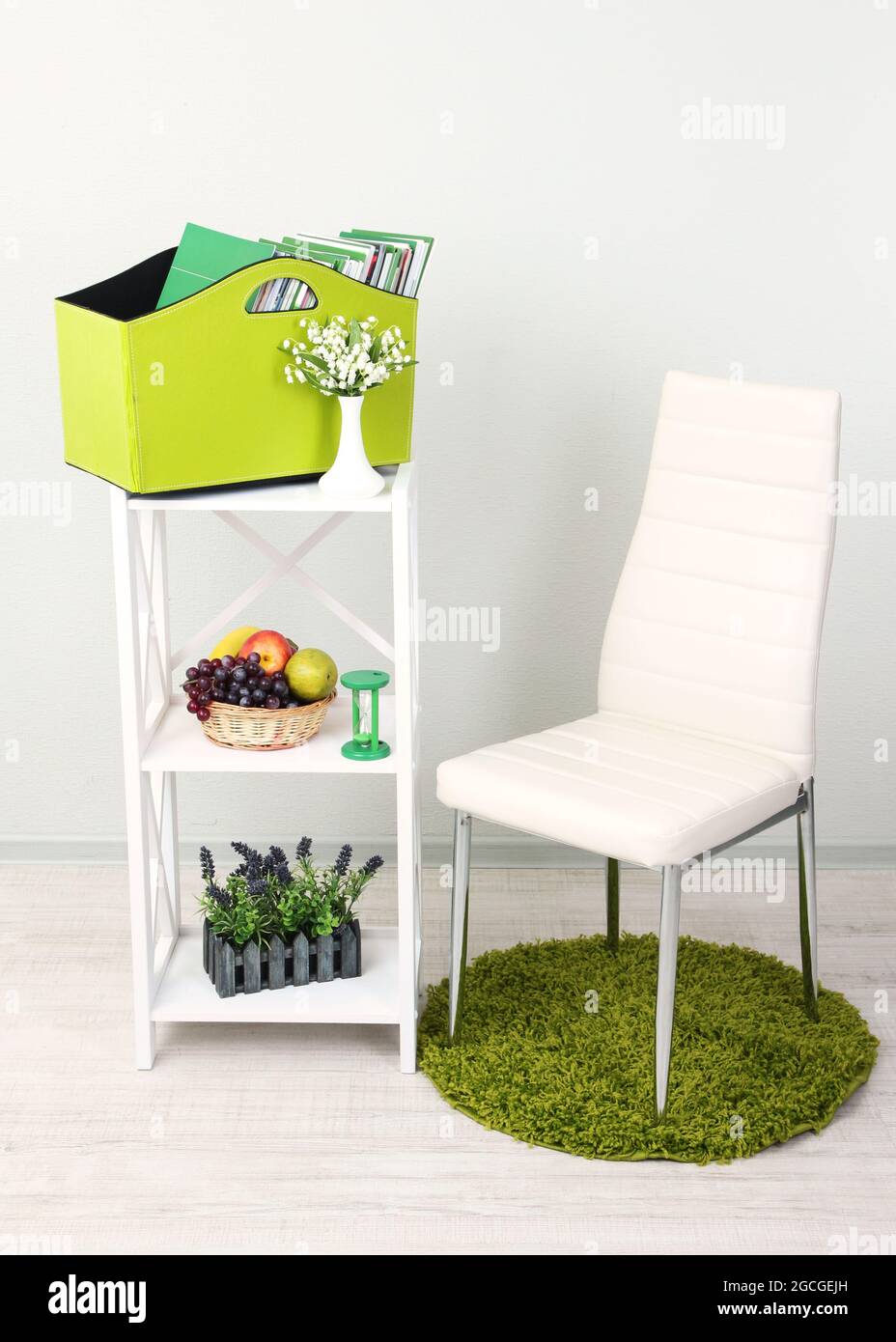 Magazines and folders in green box on shelf in room Stock Photo Alamy