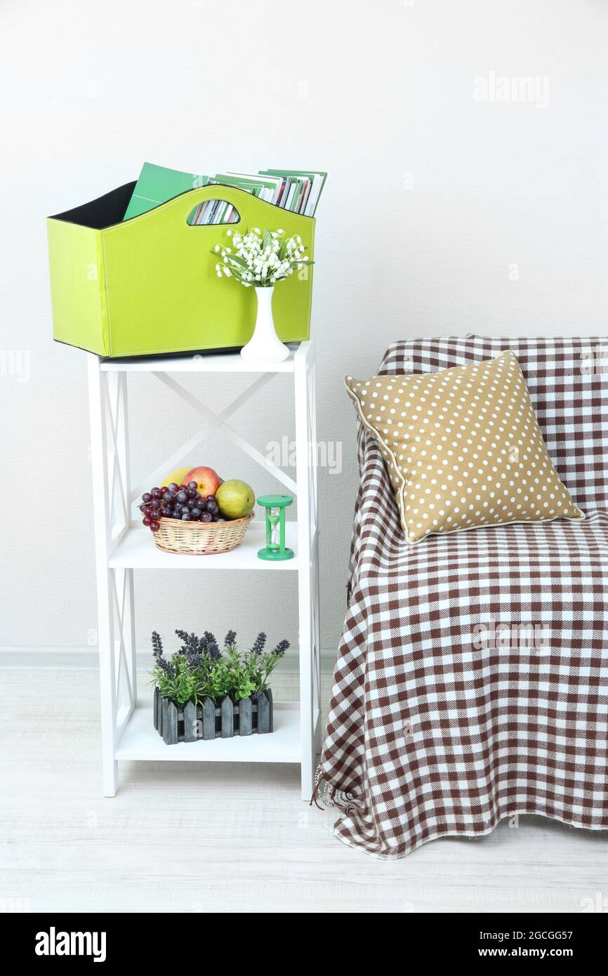 Magazines and folders in green box on shelf in room Stock Photo Alamy