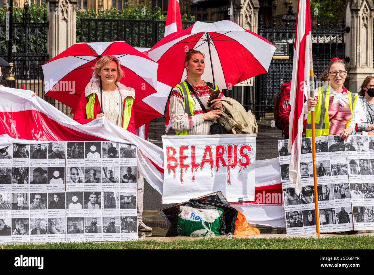 London, UK. 08th Aug, 2021. Protesters hold placards with pictures of political prisoners during the demonstration. Belarusians gathered at Parliament Square and later marched towards Westminster Bridge, hanging a flag of Belarus over the bridge. August 8th marks one year since the falsified presidential elections of 2020. The march protested against the lawless under the Lukashenko regime and calls for freedom for political prisoners. (Photo by Belinda Jiao/SOPA Images/Sipa USA) Credit: Sipa USA/Alamy Live News Stock Photo