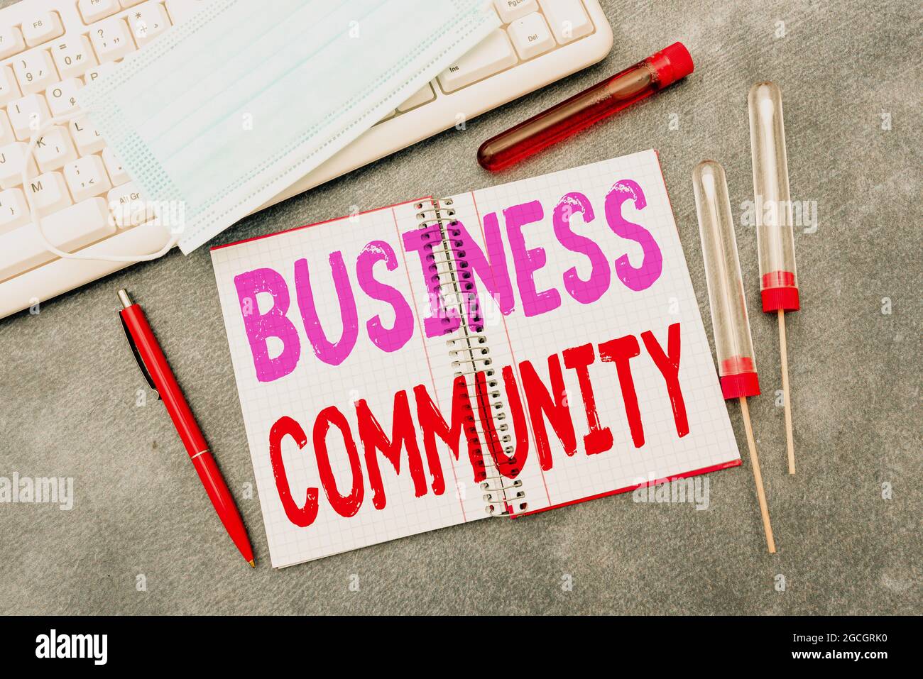 Hand writing sign Business Community. Word Written on the showing ...