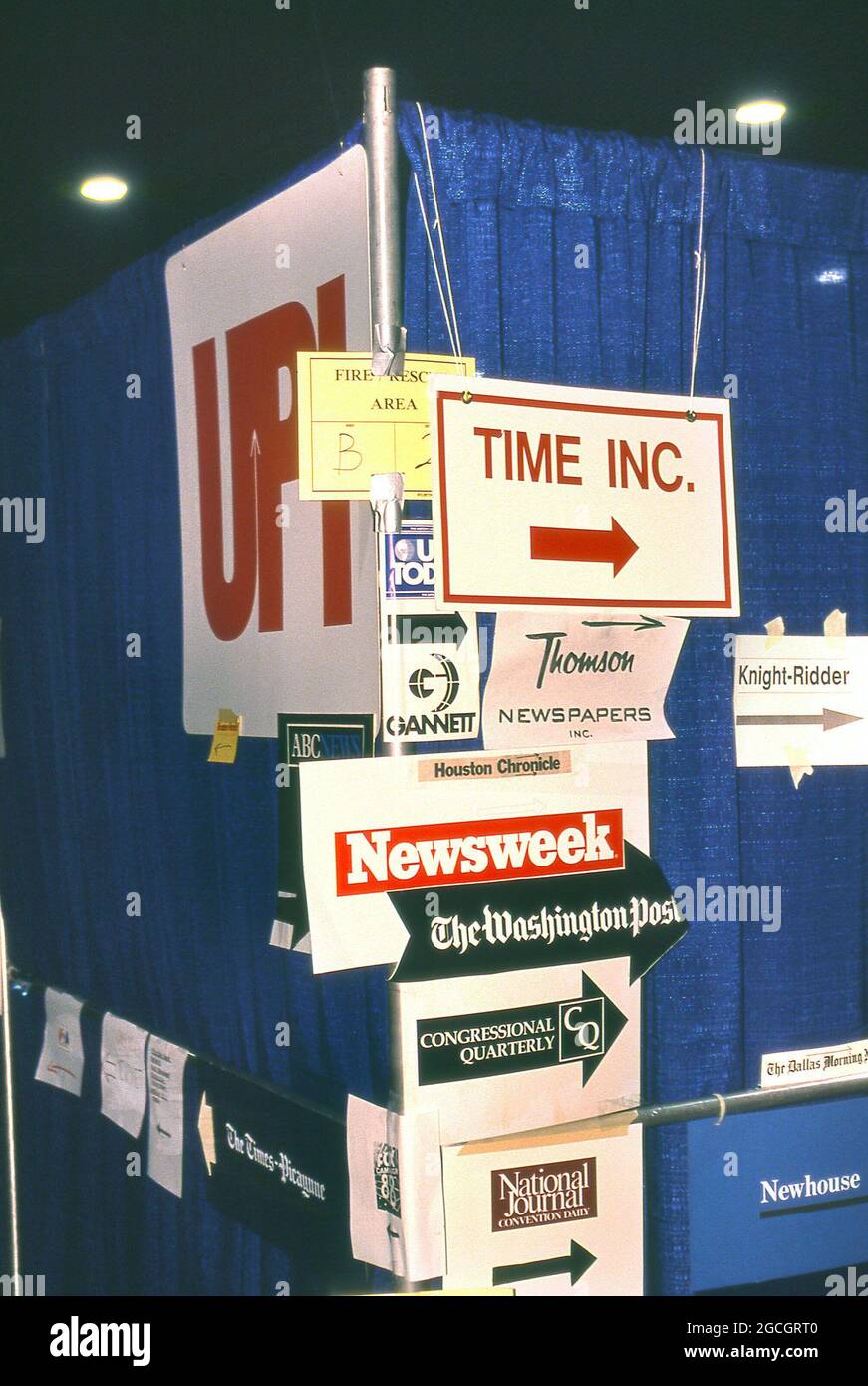 SIGNS OF THE TIMES.  Signs pointing to the offices of magazines and news services in the media work area at the Democratic Convention in July 1988. Photograph ny Dennis Brack. bb78 Stock Photo