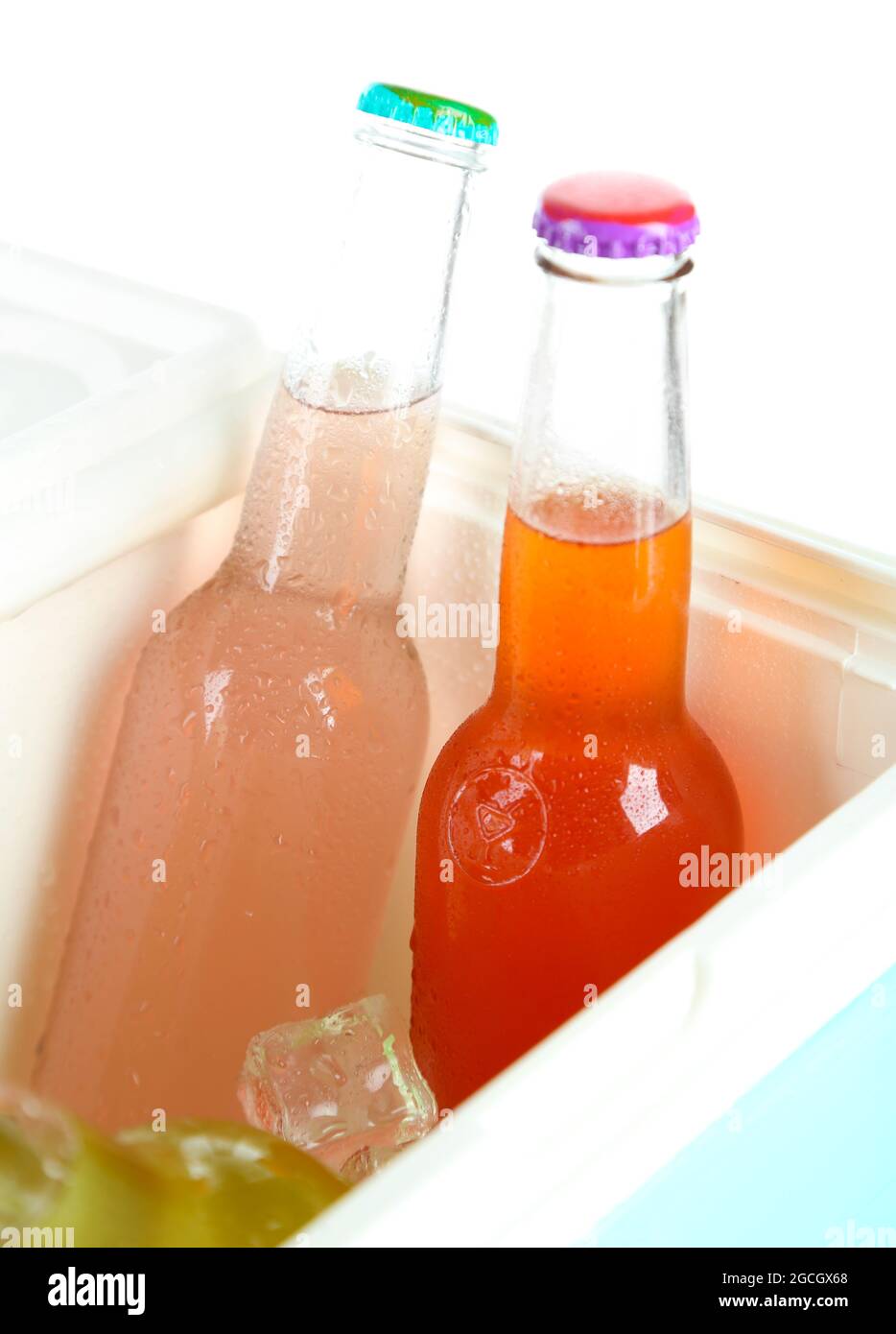 Drinks in glass bottles in mini fridge close up Stock Photo Alamy