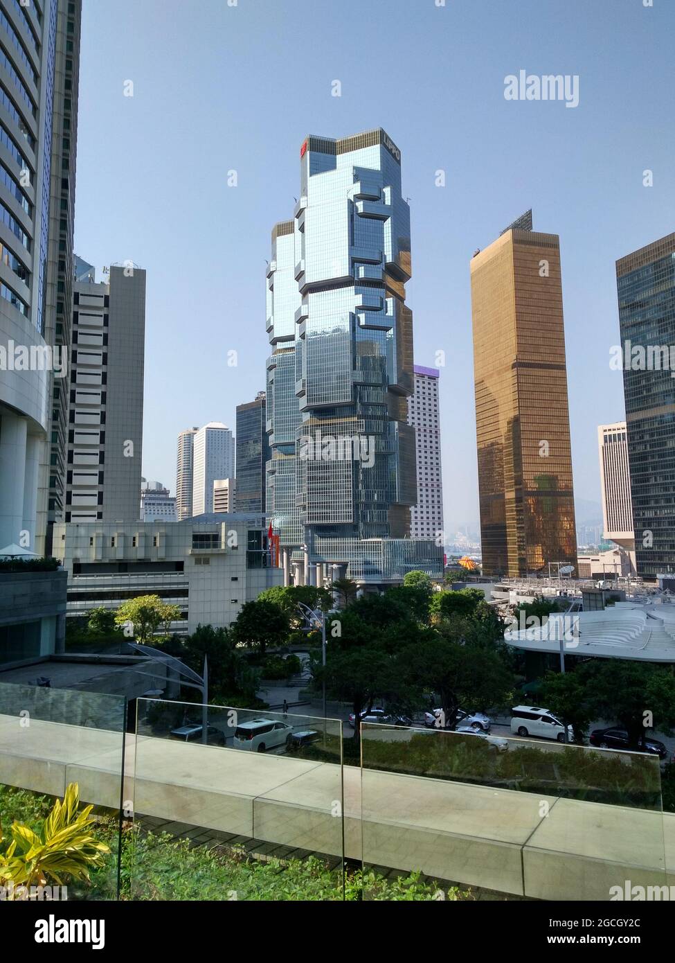 The Lippo Centre in Admiralty, the rich business financial center as seen from the Conrad Hotel with tons of skyscrapers, high rises, and cars Stock Photo