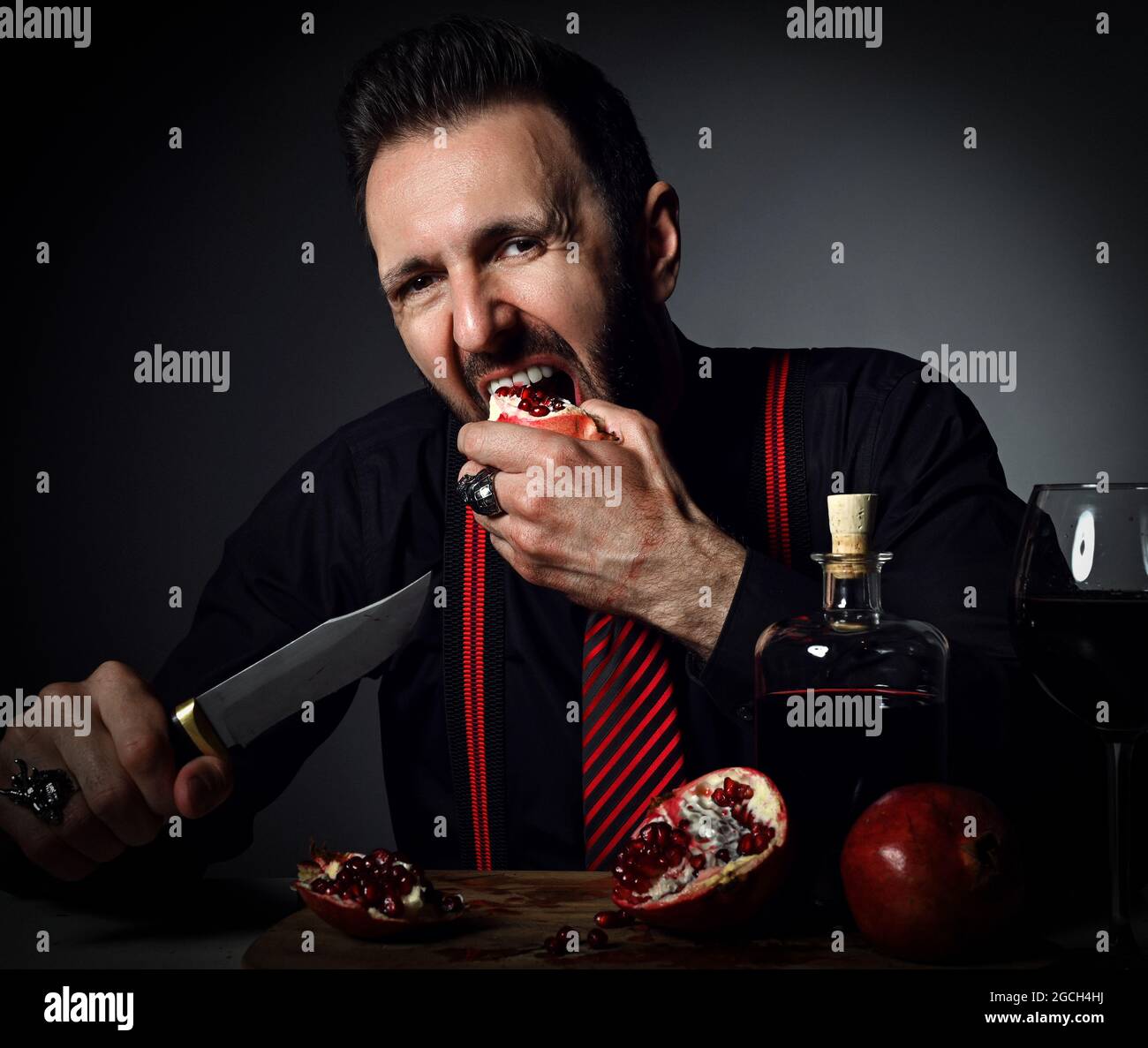 Man holding knife in mouth hires stock photography and images Alamy