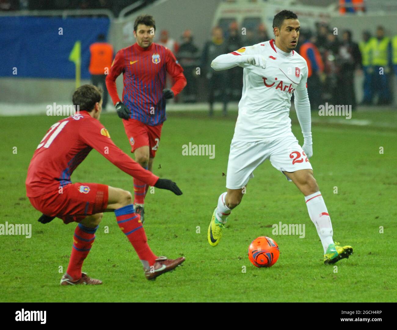 BUCHAREST, ROMANIA - FEBRUARY 16, 2012: Nacer Chadli (R) of Twente pictured in action during the first leg of the 2011/12 UEFA Europa League Round of 32 game between FCSB and FC Twente at National Arena. Stock Photo
