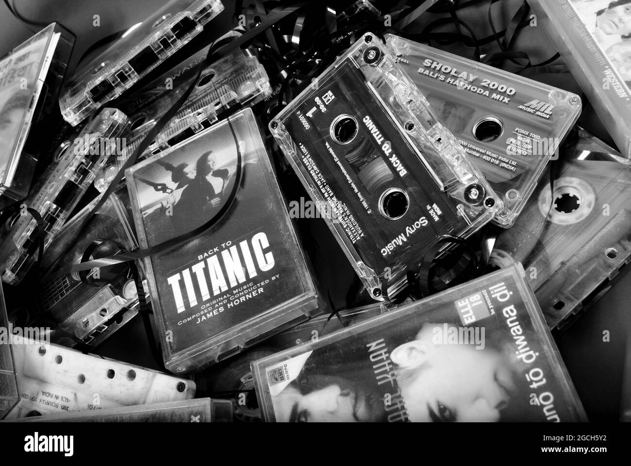 PORBANDAR, INDIA - Jul 16, 2016: A grayscale picture of a few Cassette tapes of popular movies and music Stock Photo