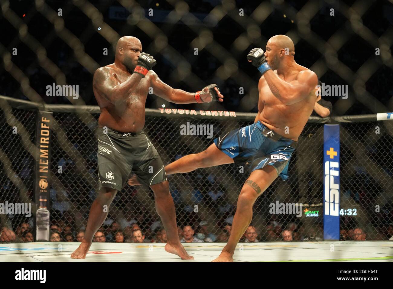 R-L) Ciryl Gane kicks Derrick Lewis in their Interim Heavyweight (Title)  bout during the UFC 265 - Lewis vs Gane at Toyota Center on August 7, 2021  in Houston, TX, United States.
