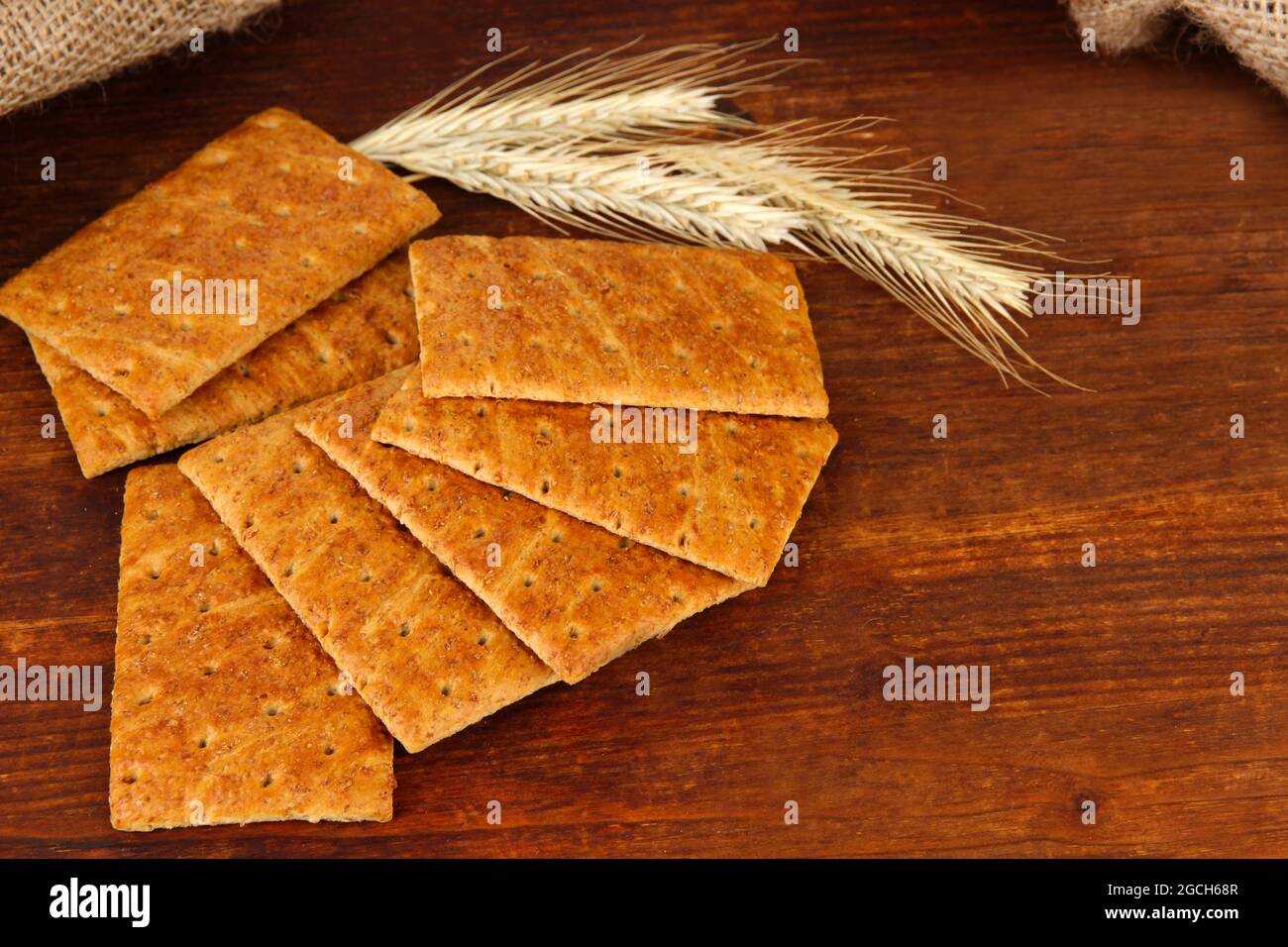 Delicious crackers with spikes on wooden background Stock Photo Alamy